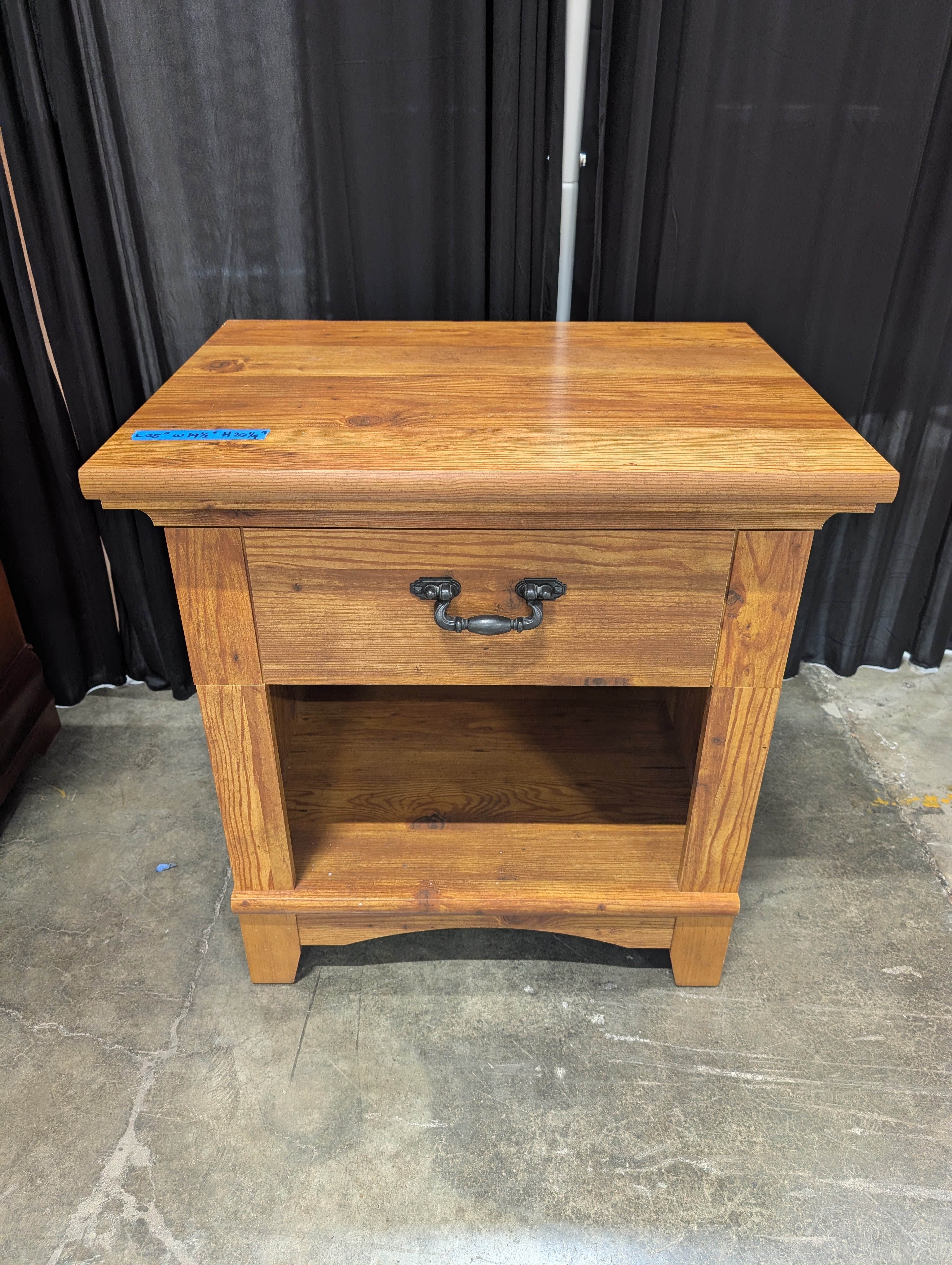 Brown Stained Wood Nightstand with Ornate Drawer Pull