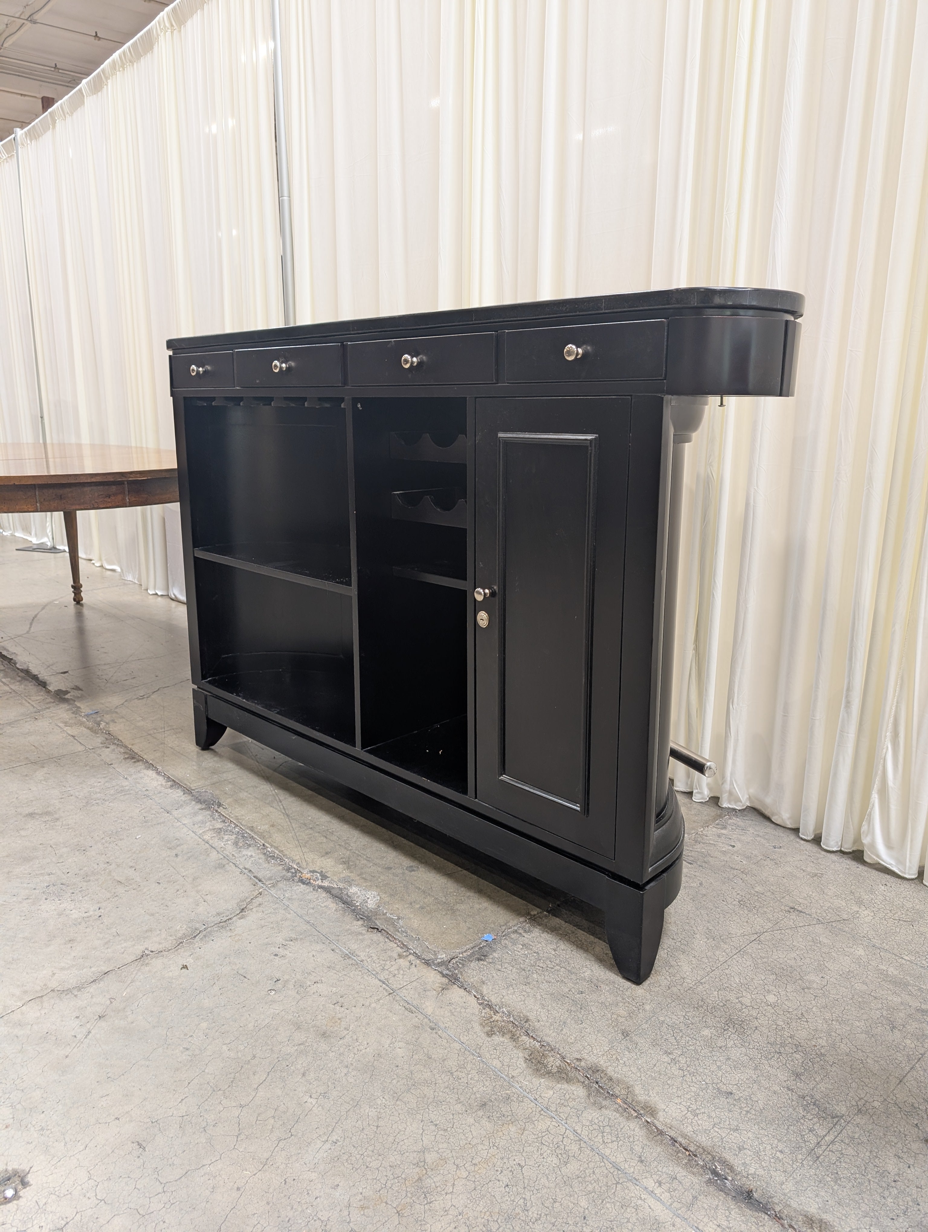 Dark Curved Wood Home Bar with Metal Foot Rail