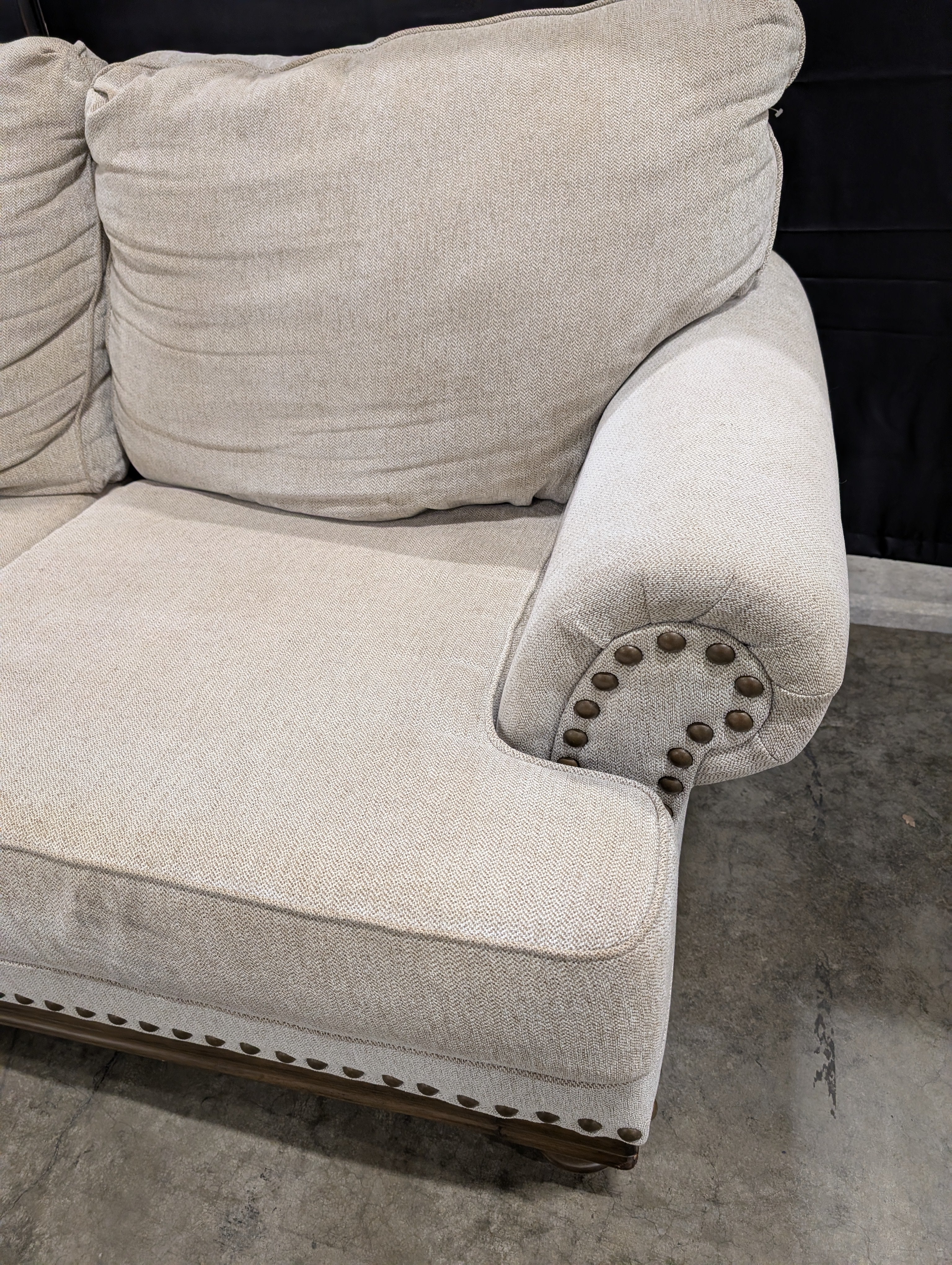 Neutral Three-Cushion Nail Trim Sofa