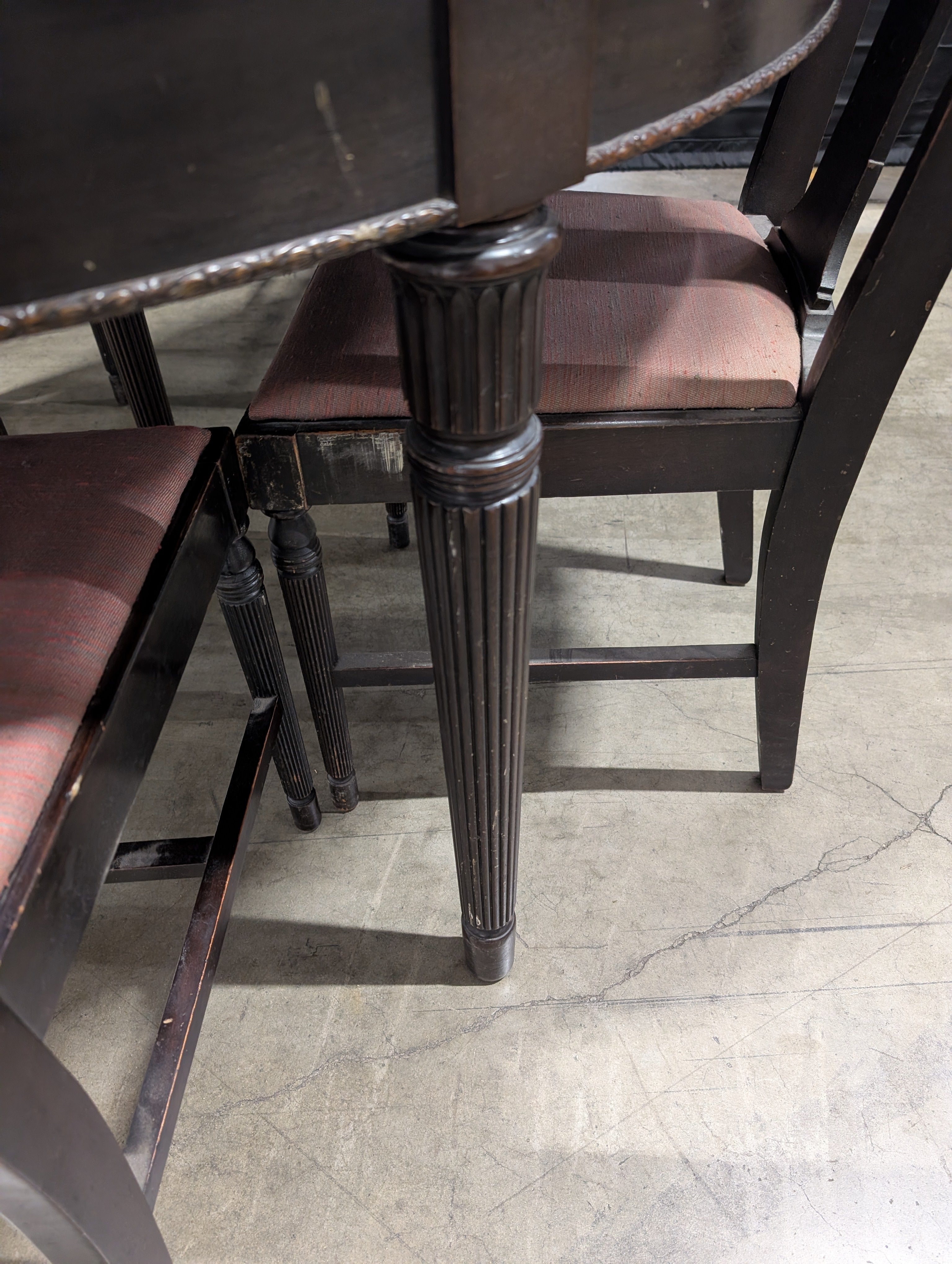 Dark Wood Oval Extendable Dining Table with Seven matching Chairs