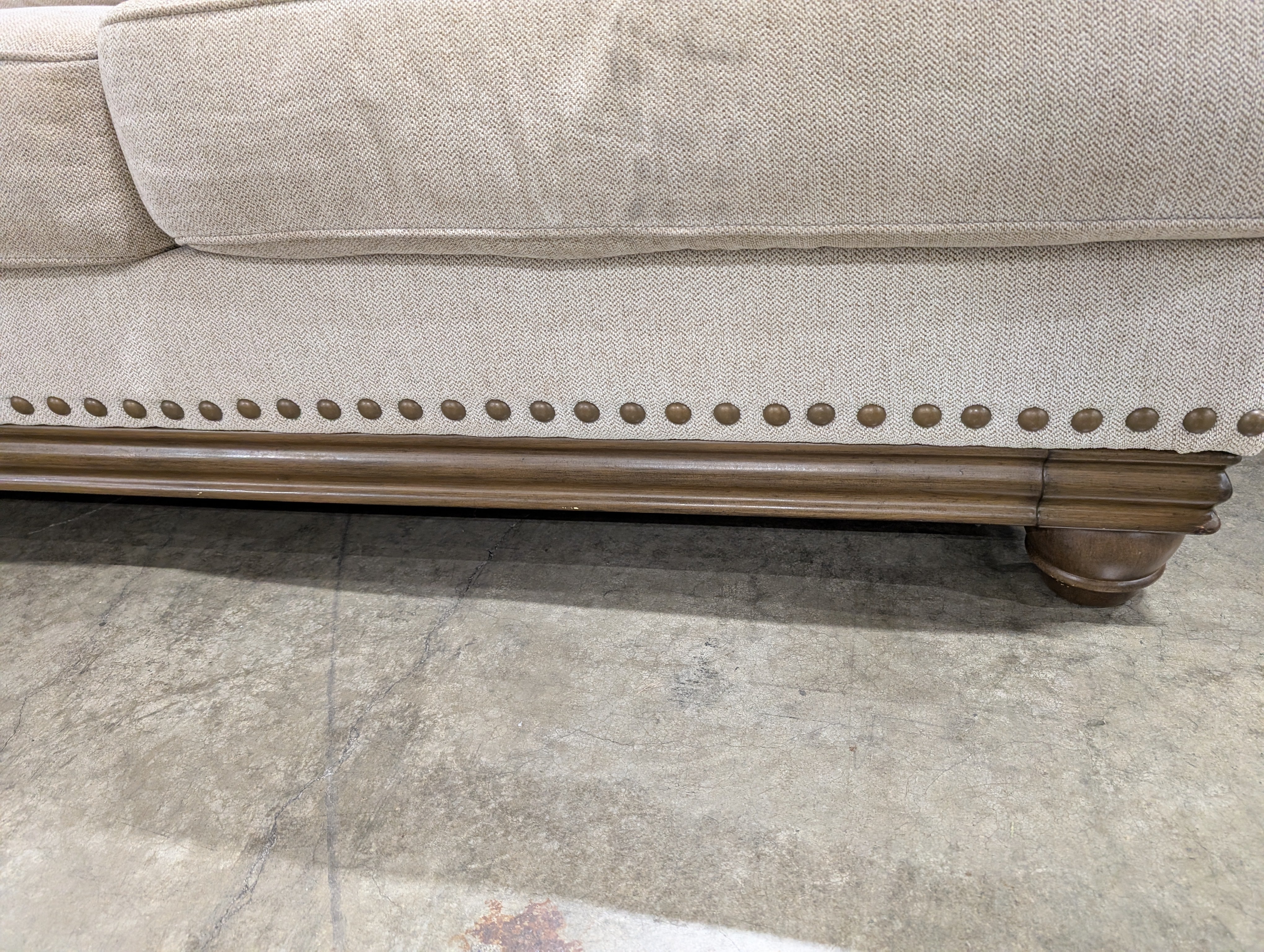 Neutral Three-Cushion Nail Trim Sofa
