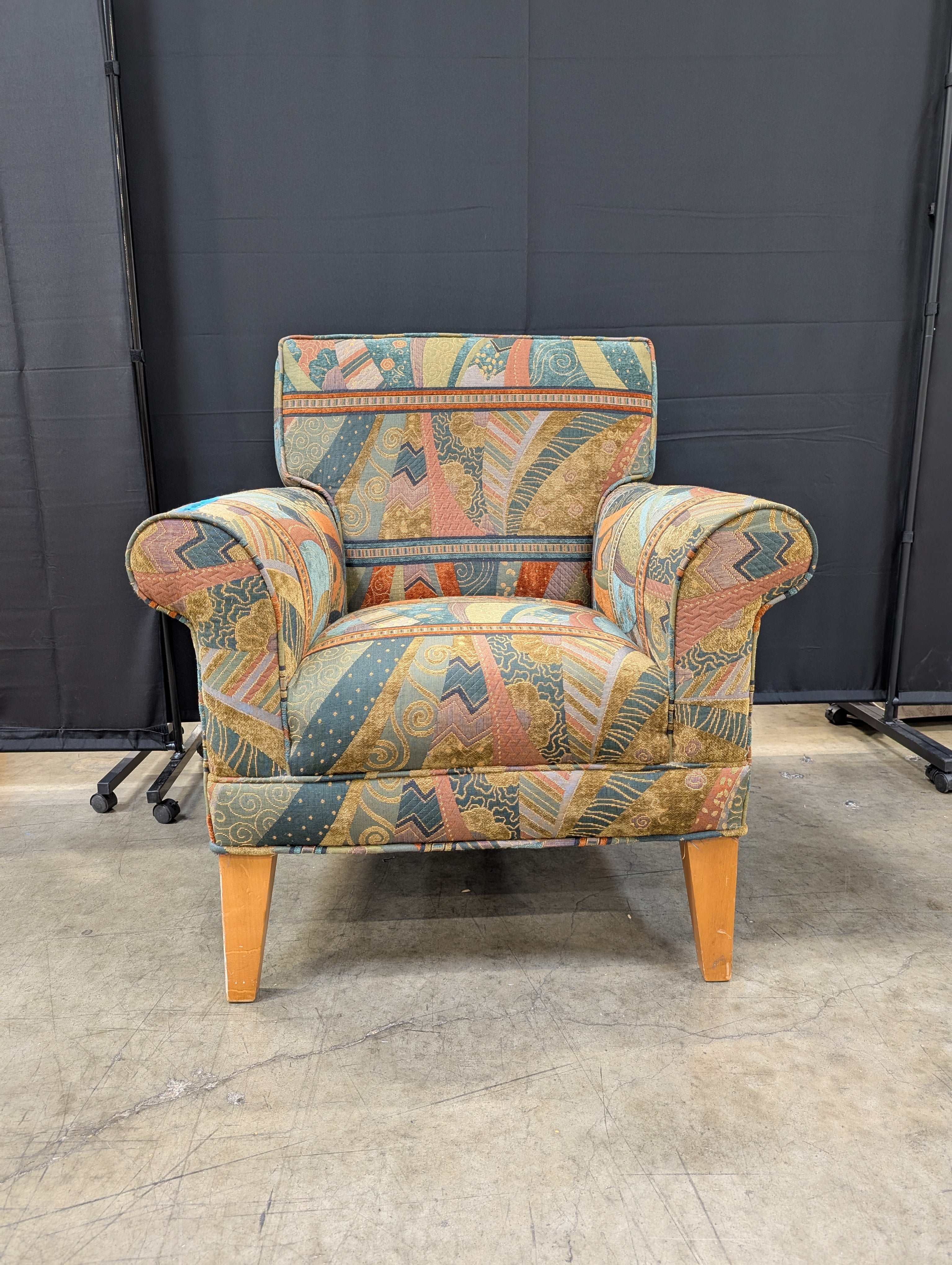 Vibrant Multi-Color Upholstered Armchair Cushion with Eclectic Pattern