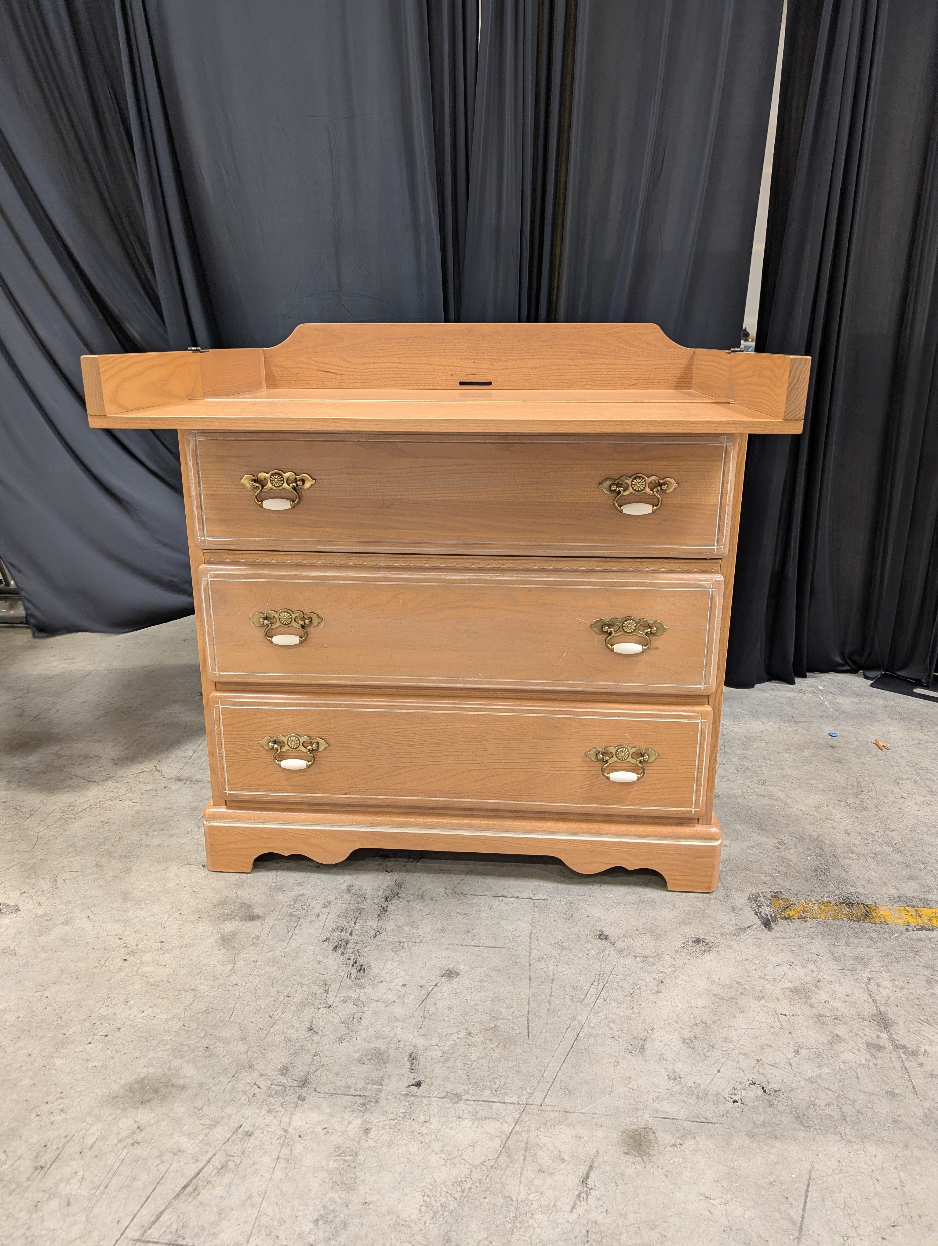 Light Brown Wood Dresser with Ornate Hardware