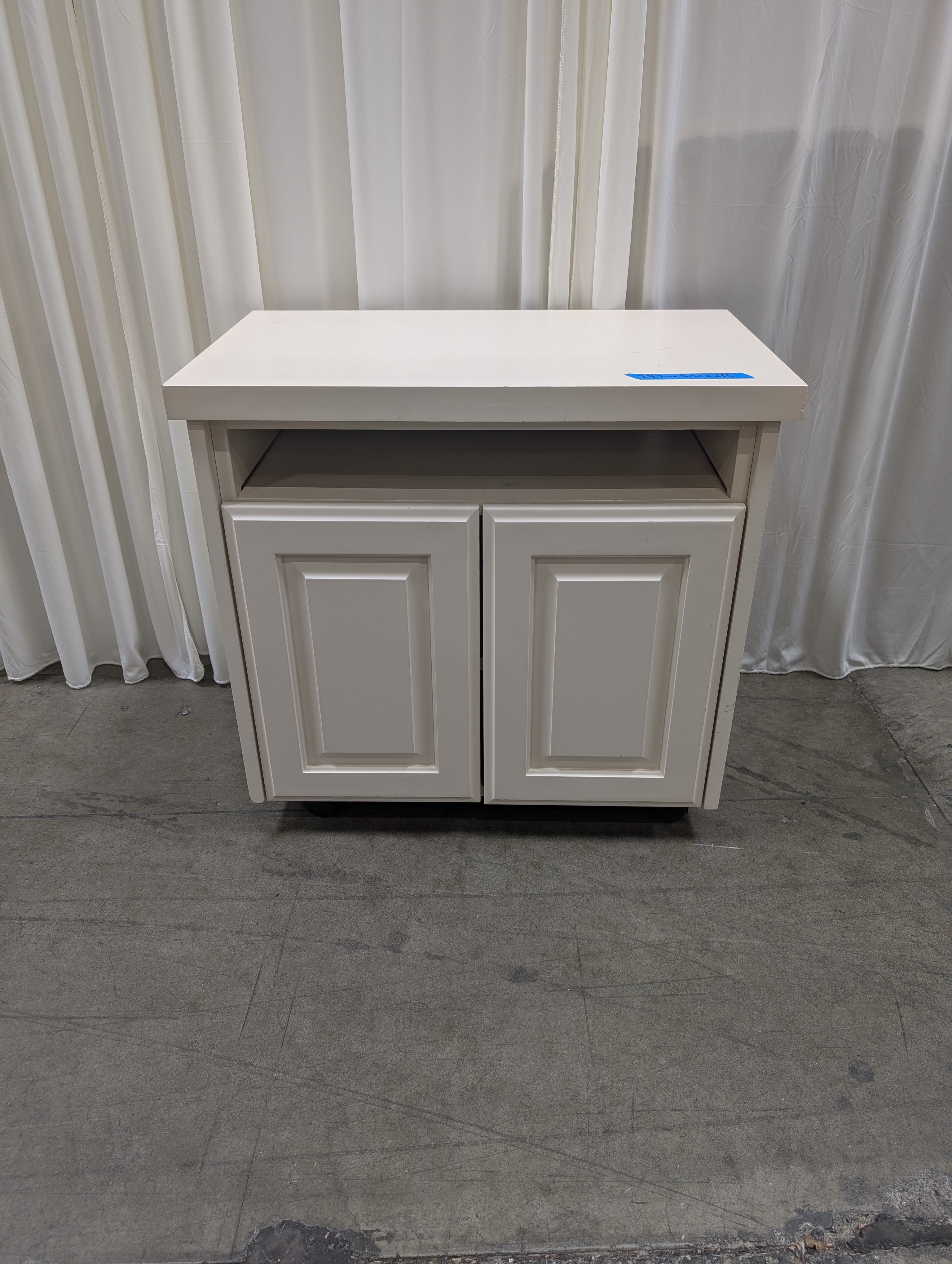 White Wood Two-Door TV Stand with Open Shelf