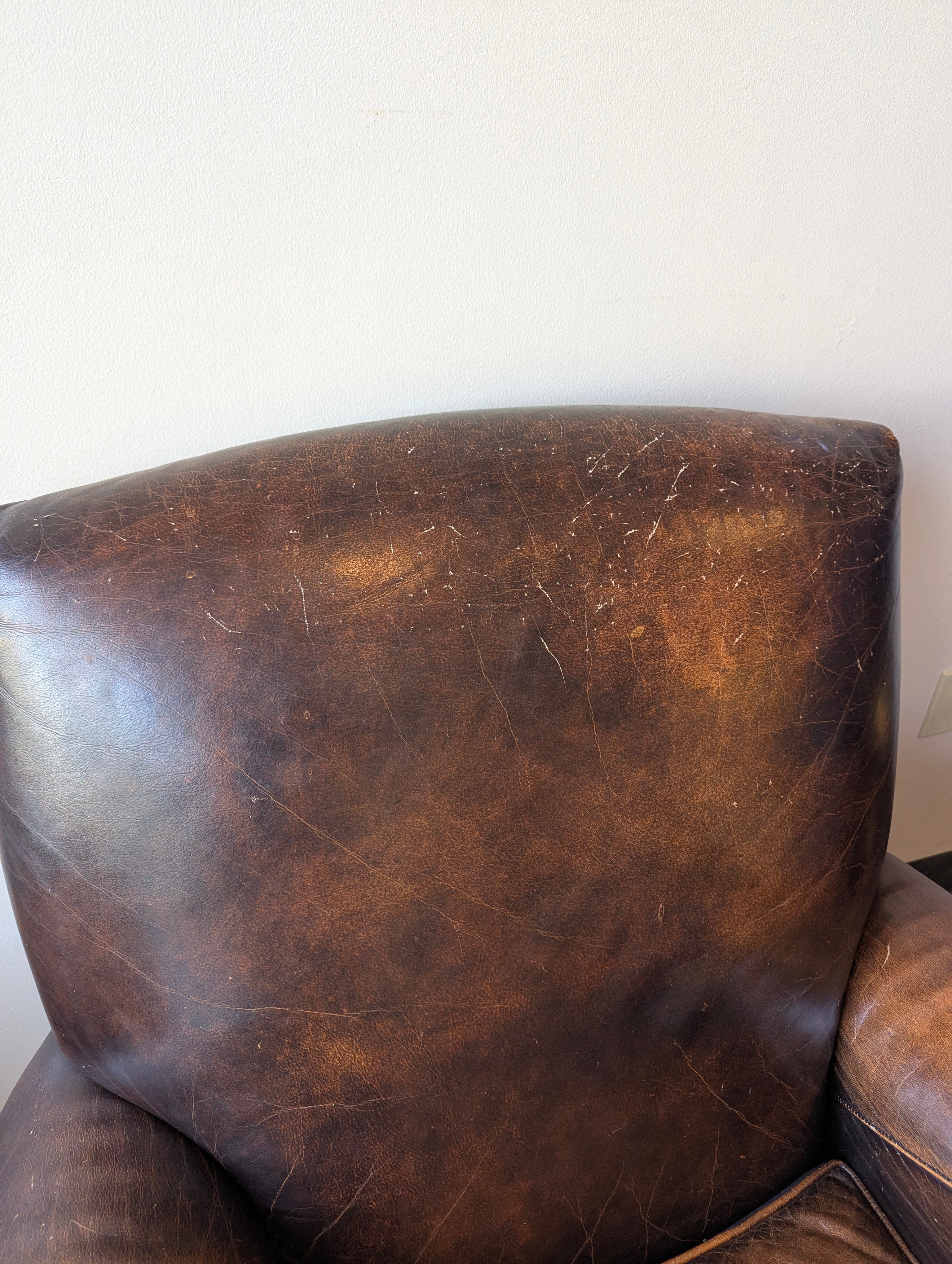 Distressed Brown Leather Club Chair with Rolled Arms