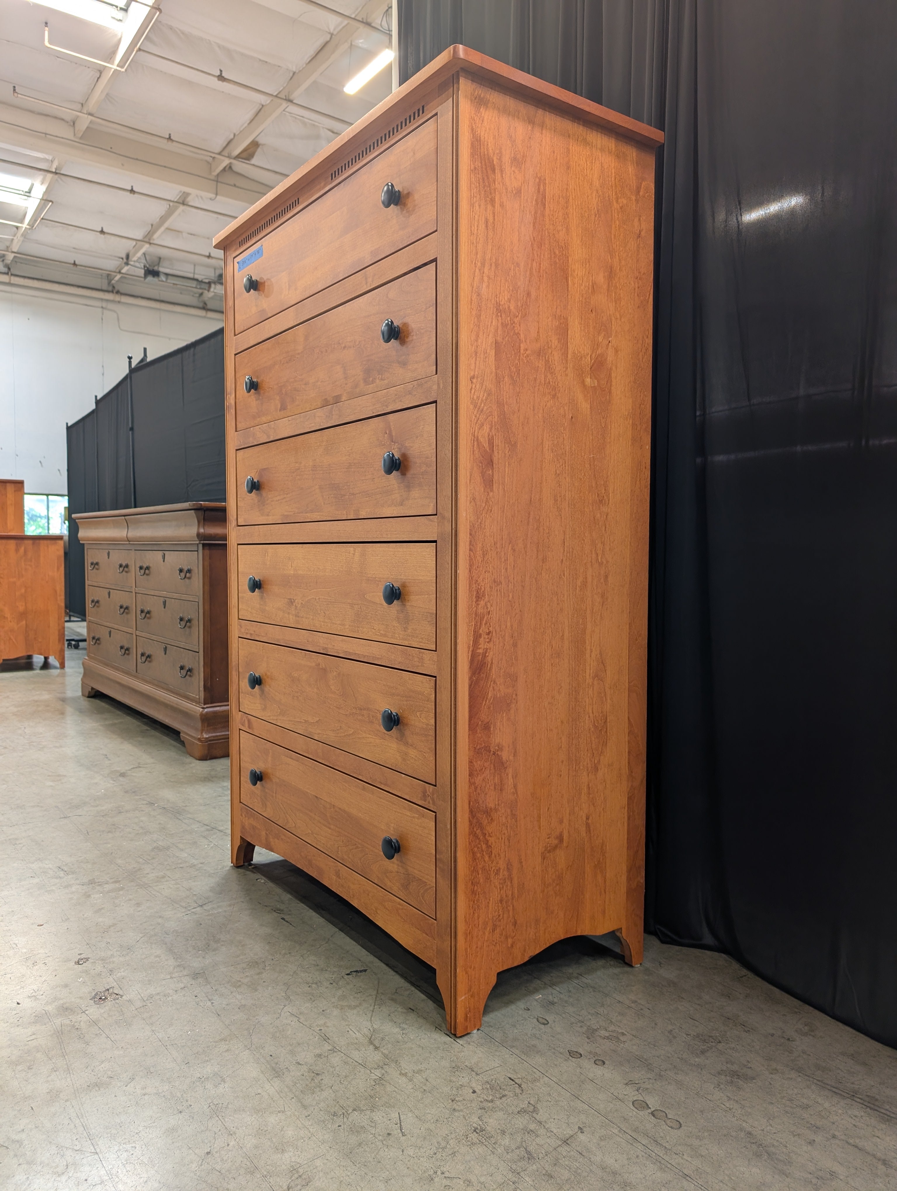 Warm Honey Wood Six-Drawer Dresser with Dark Knobs