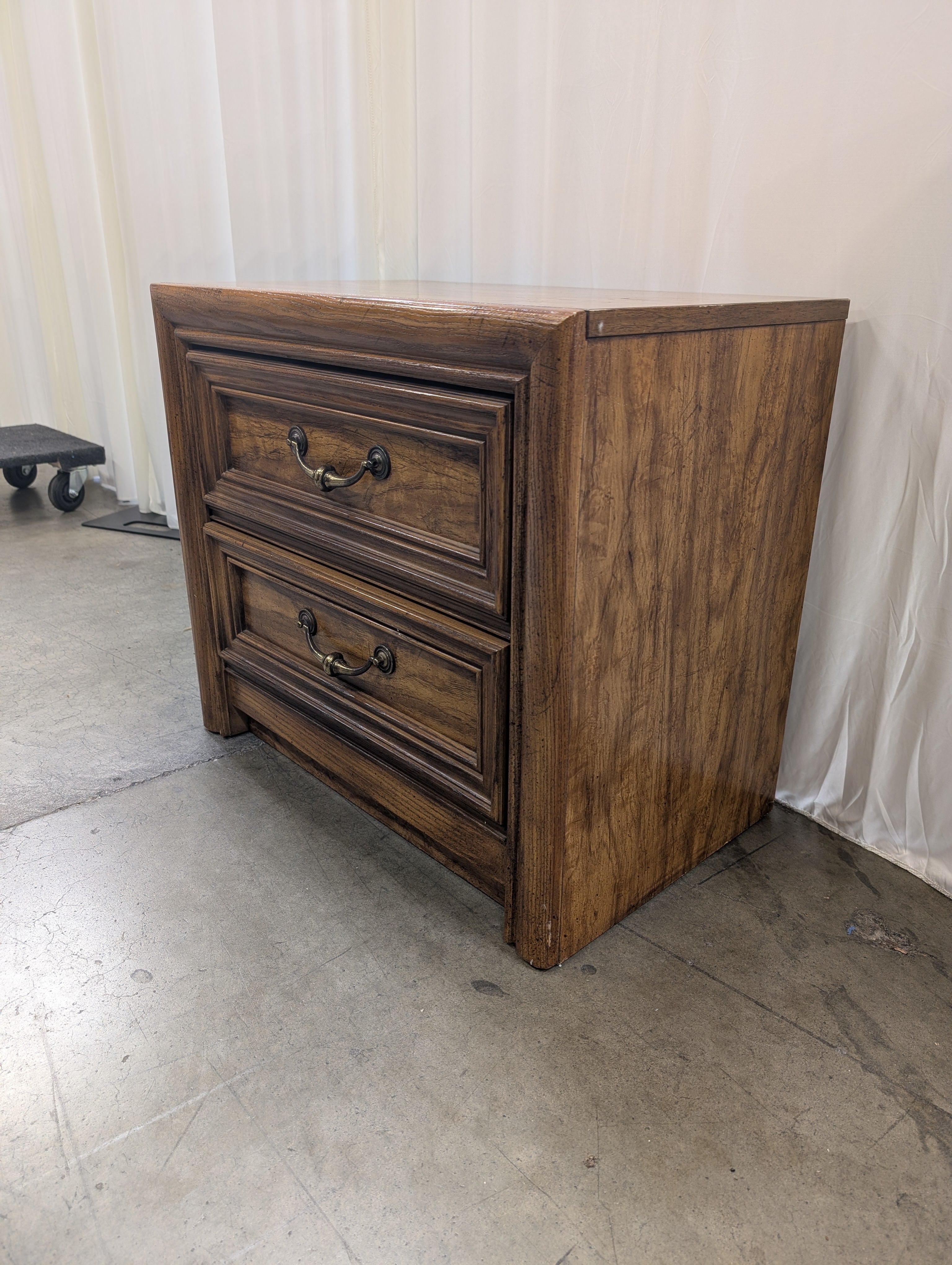Warm Brown Wood Two-Drawer Nightstand with Ornate Hardware