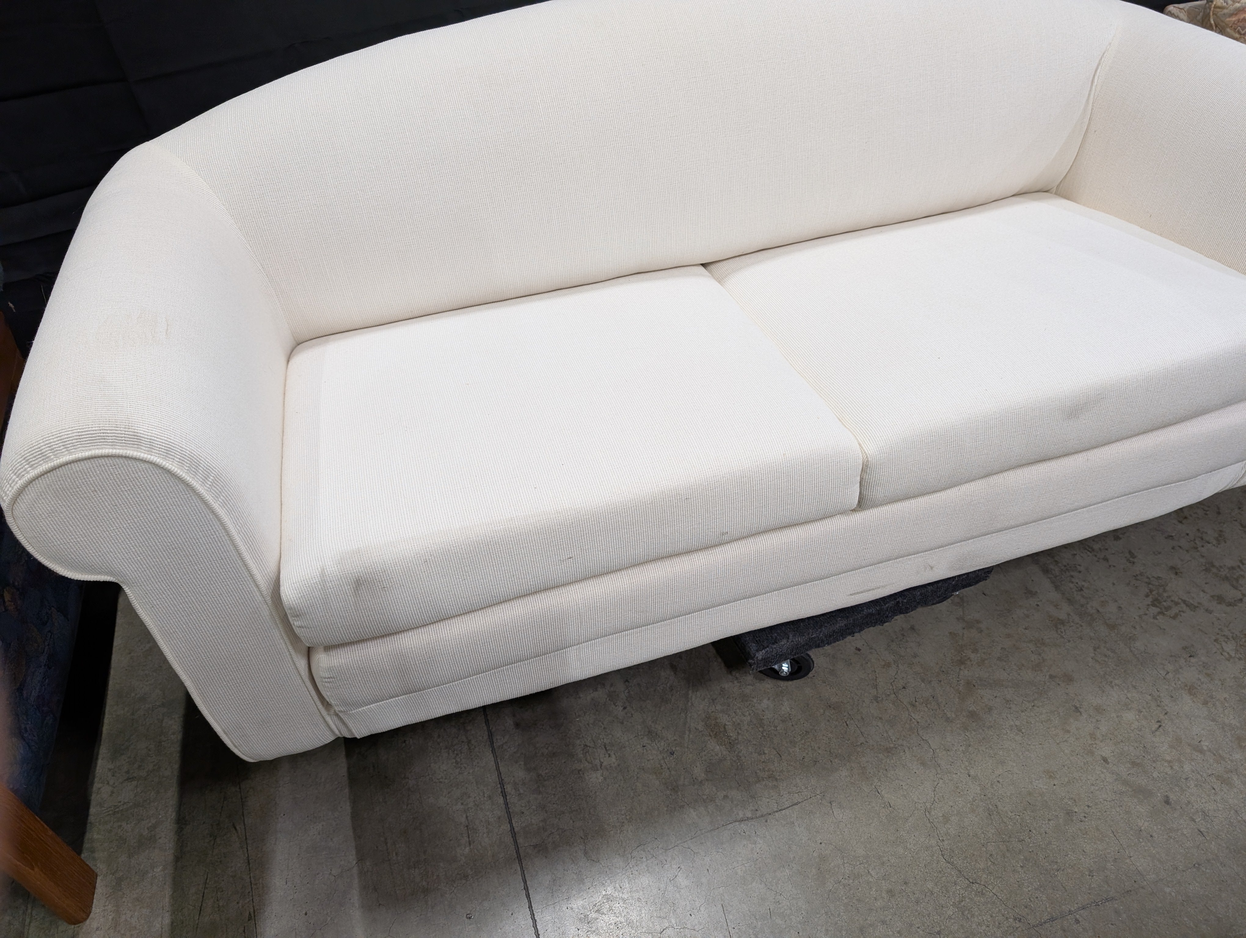 Cream-Colored Two-Seater Sofa