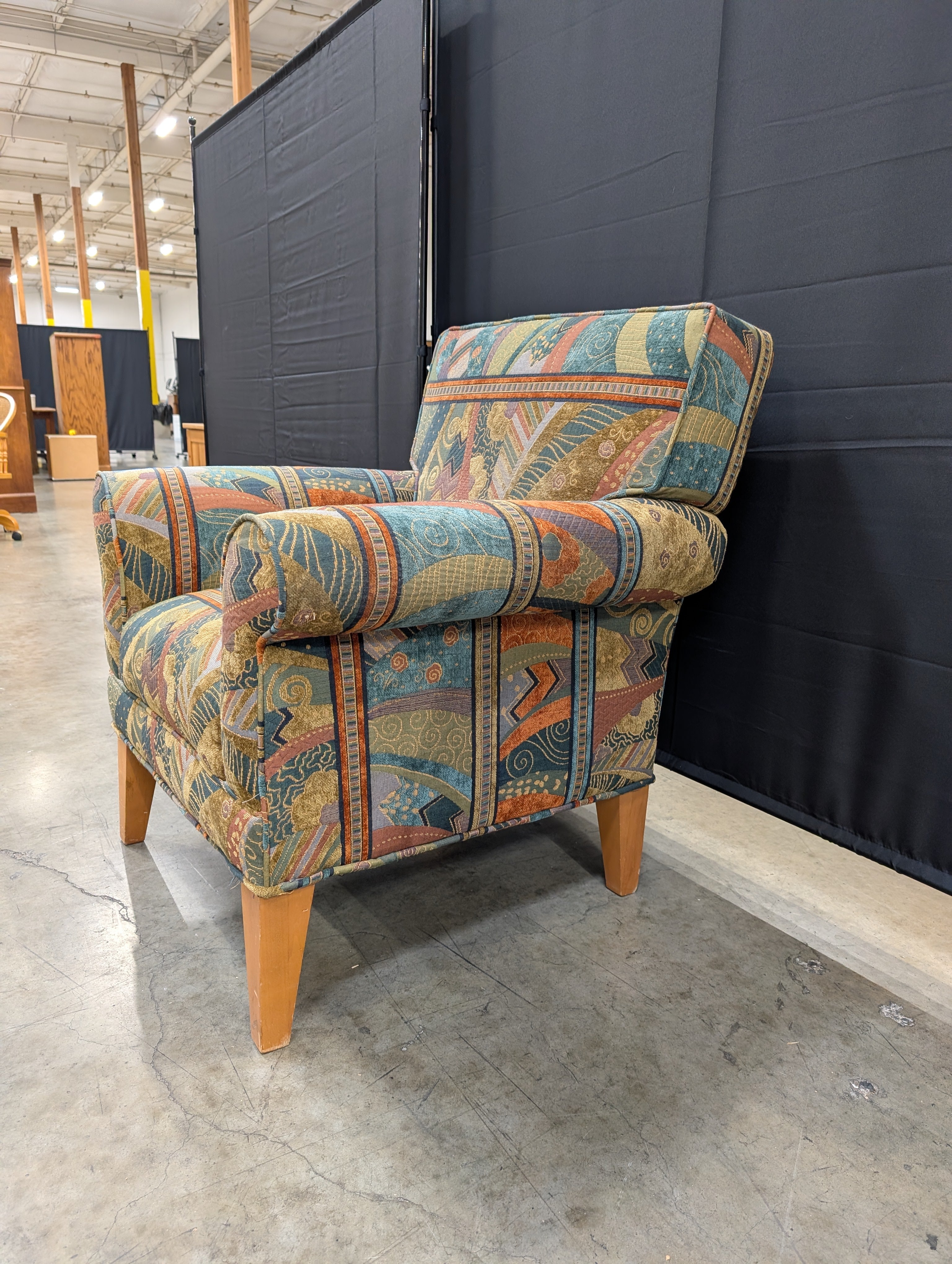 Vibrant Multi-Color Upholstered Armchair Cushion with Eclectic Pattern