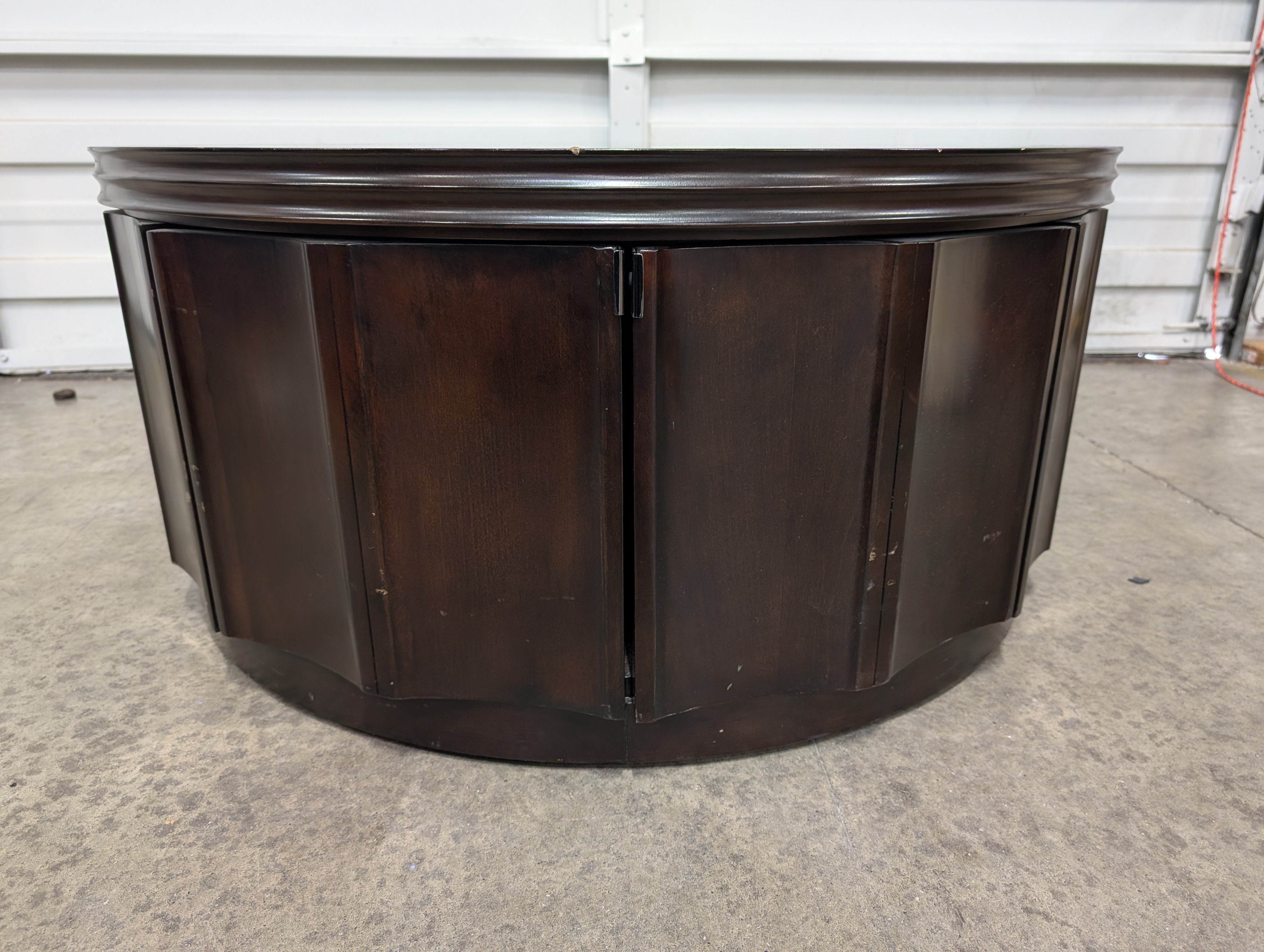 Circular Dark Wood Coffee Table with Paneled Sides
