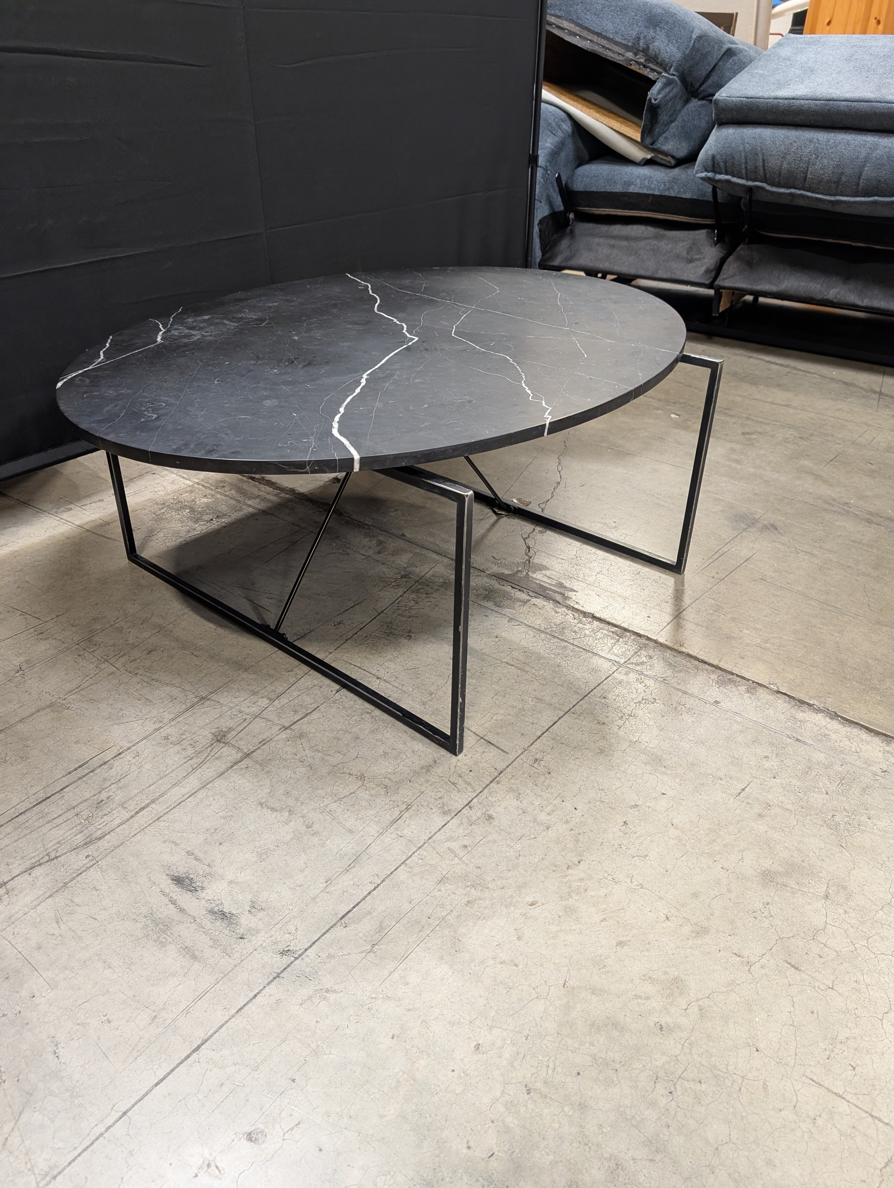 Modern Oval Stone Top Coffee Table with Geometric Metal Base