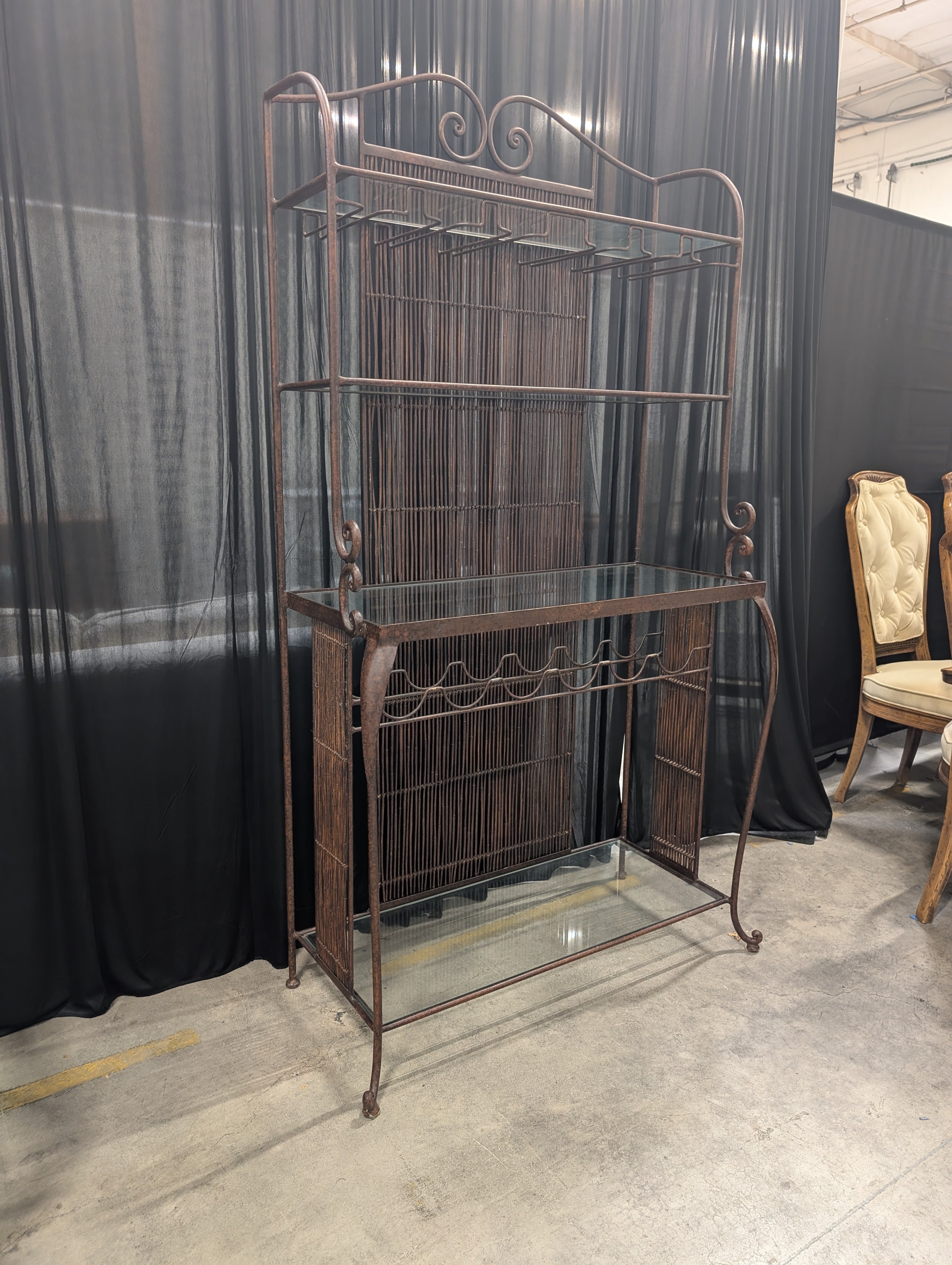Ornate Dark Metal Baker's Rack with Woven Back