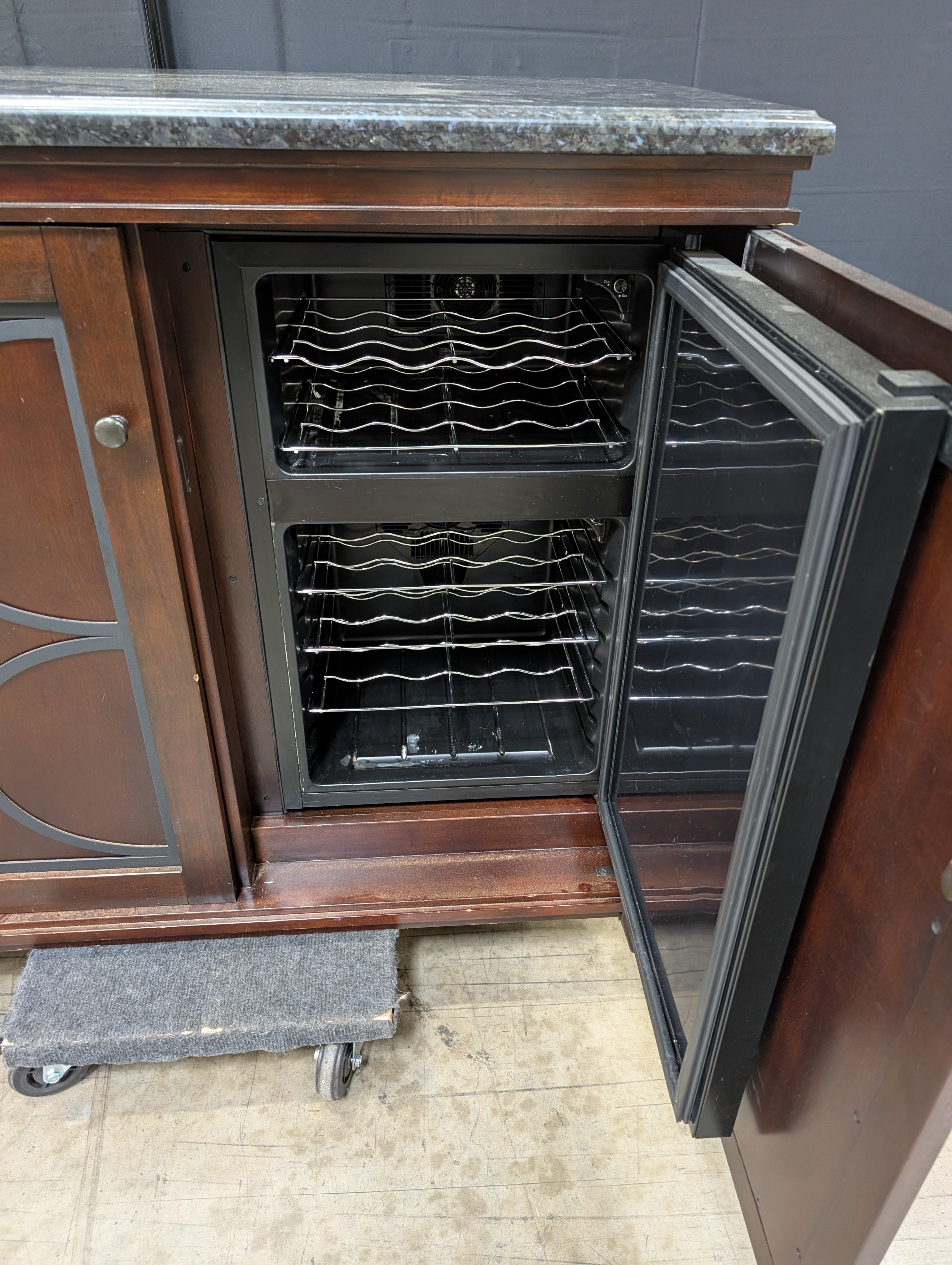 Dark Wood Storage Cabinet with Granite Top and Decorative Doors