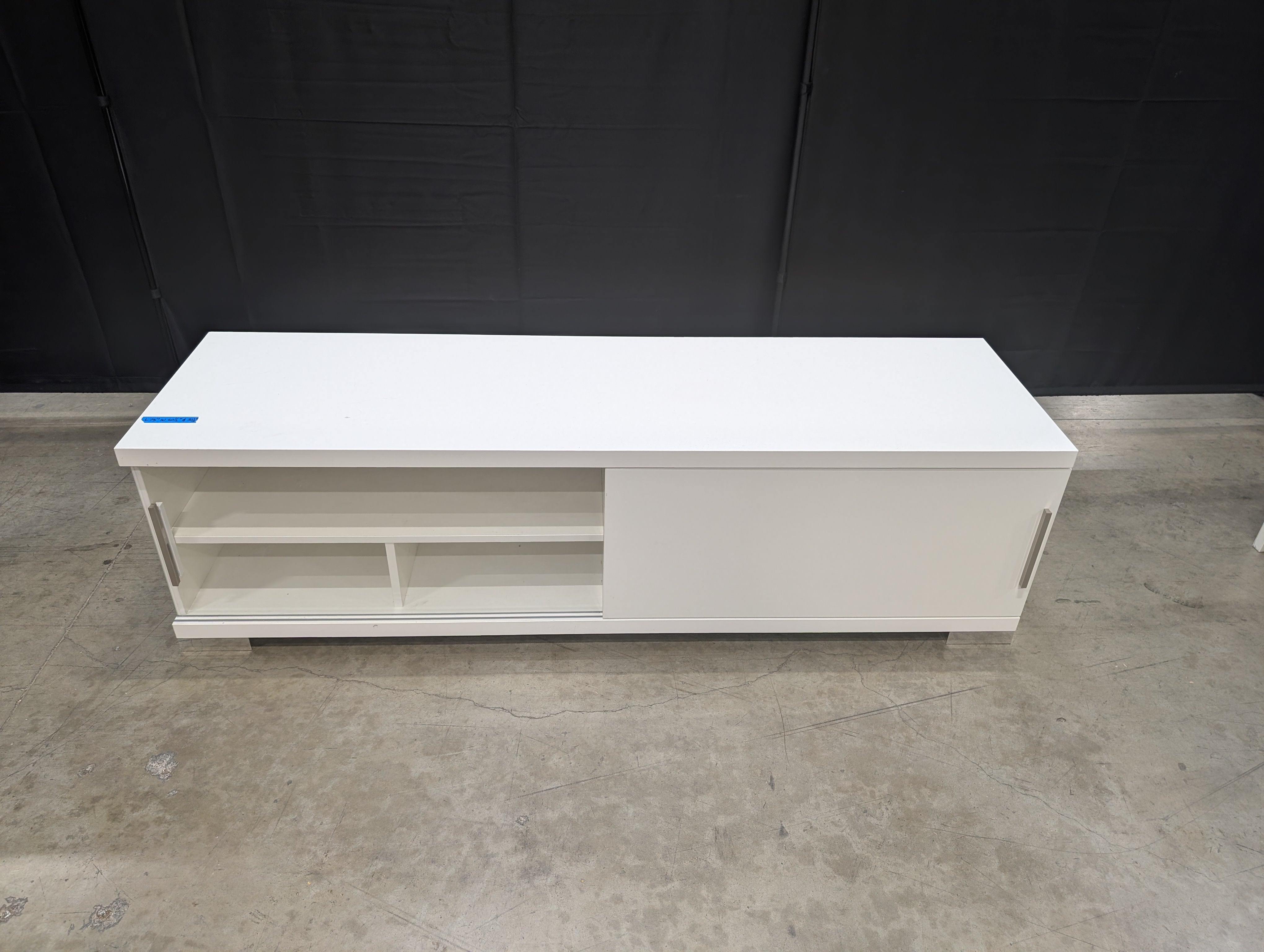 Sleek White Entertainment Unit with Sliding Doors