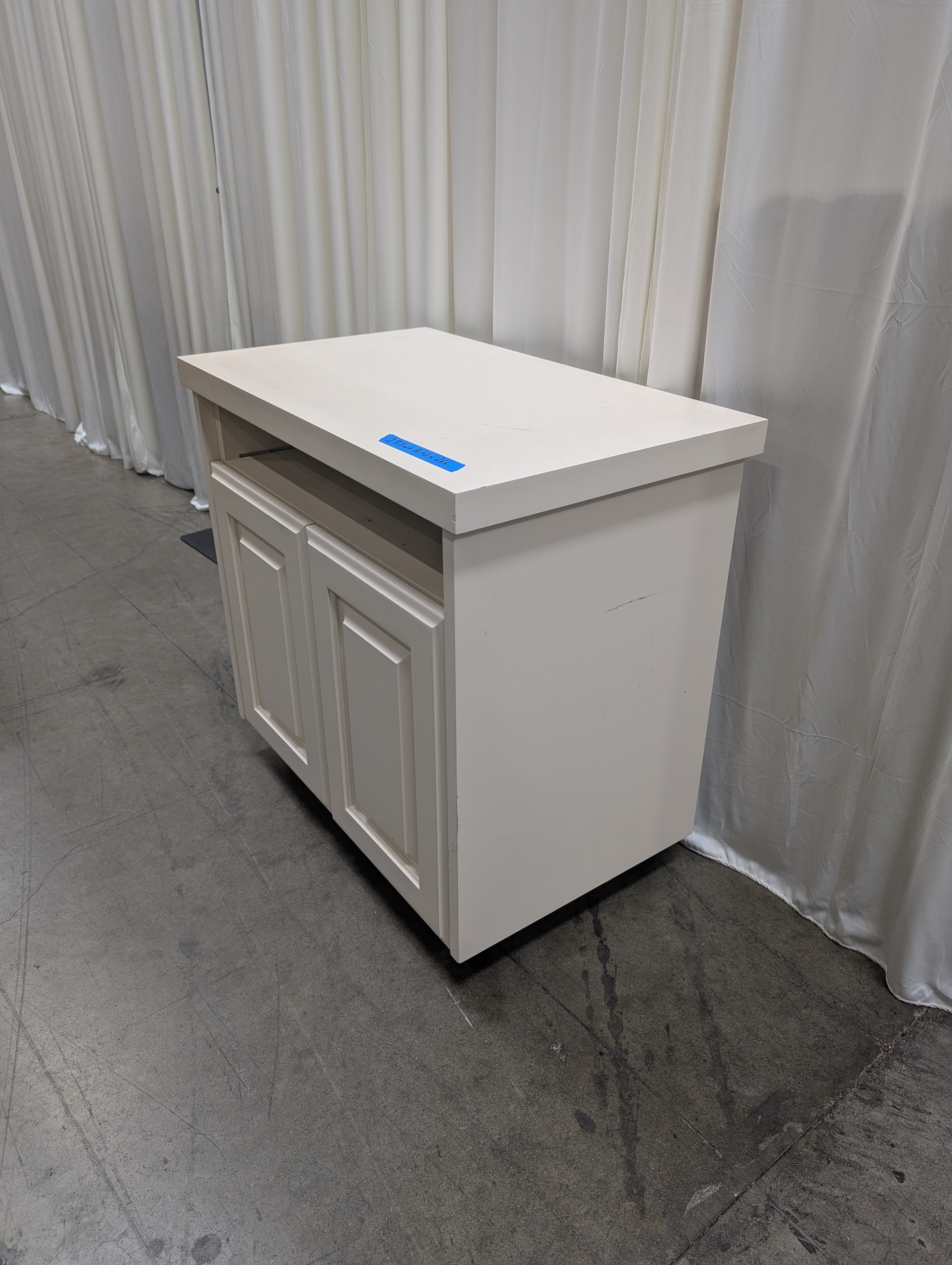 White Wood Two-Door TV Stand with Open Shelf