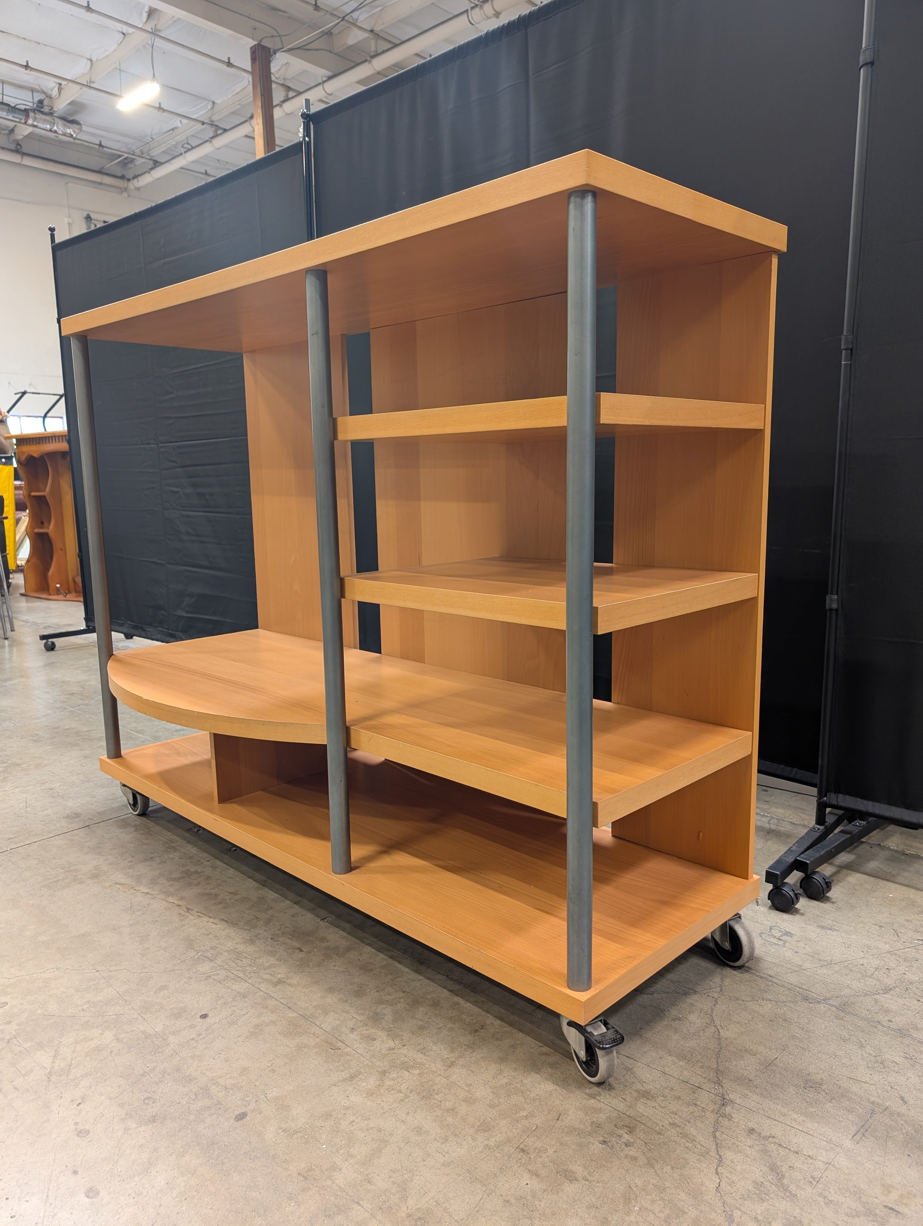 Contemporary Wood Tone Shelving Unit with Metal Supports and Casters