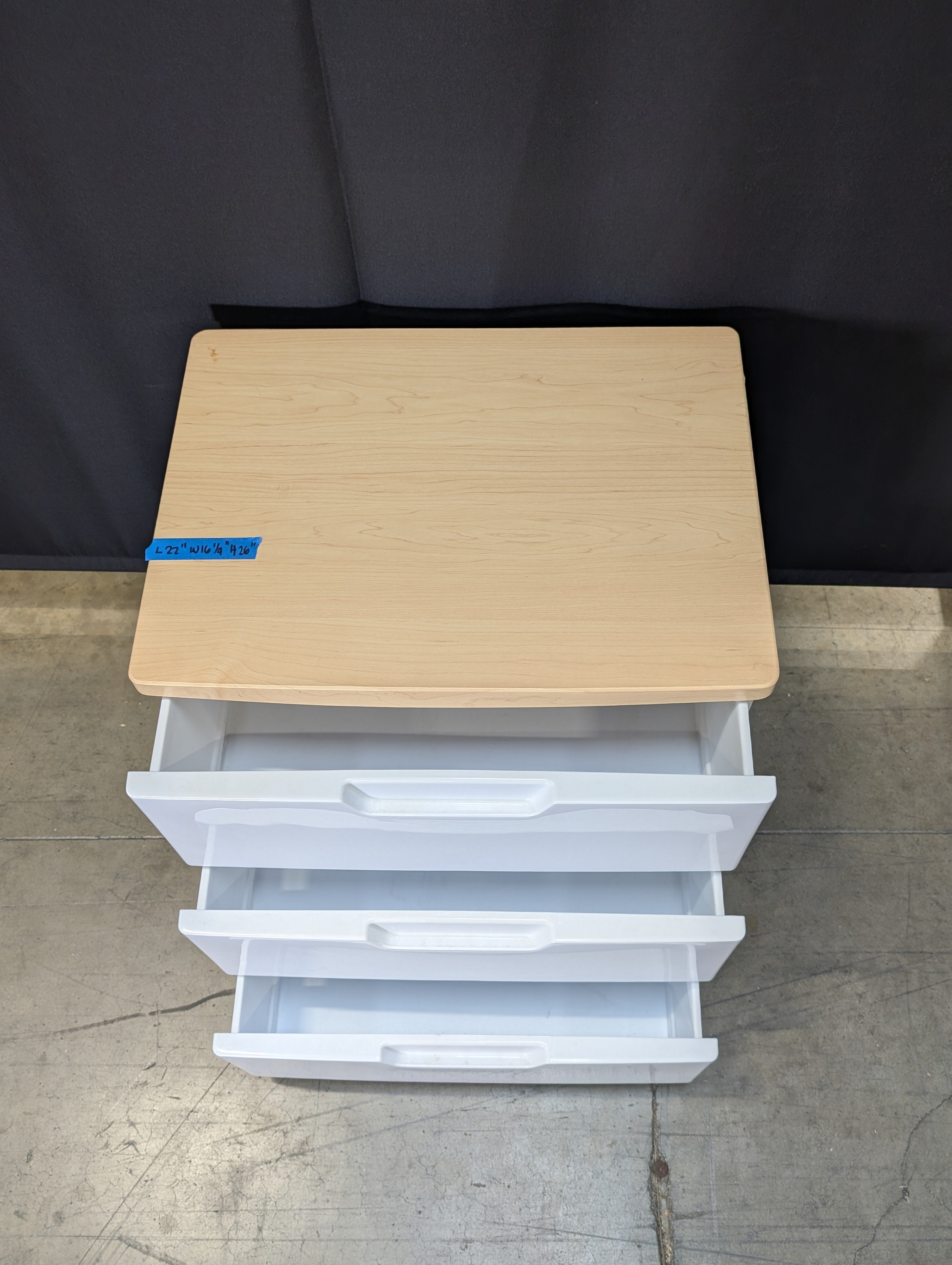 Contemporary White Three-Drawer Chest with Light Wood Surface