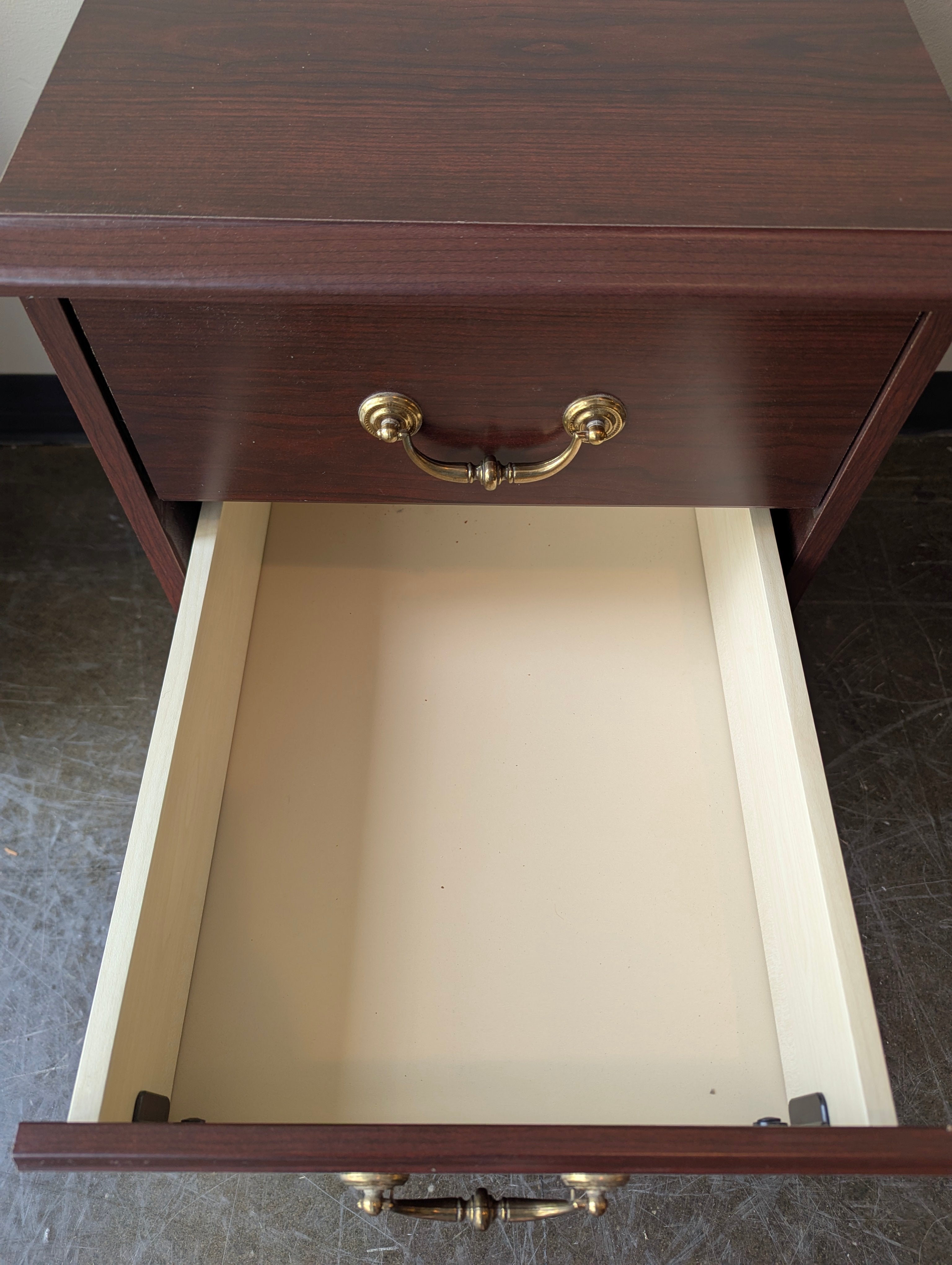 Compact Dark Wood Three-Drawer Storage Cabinet