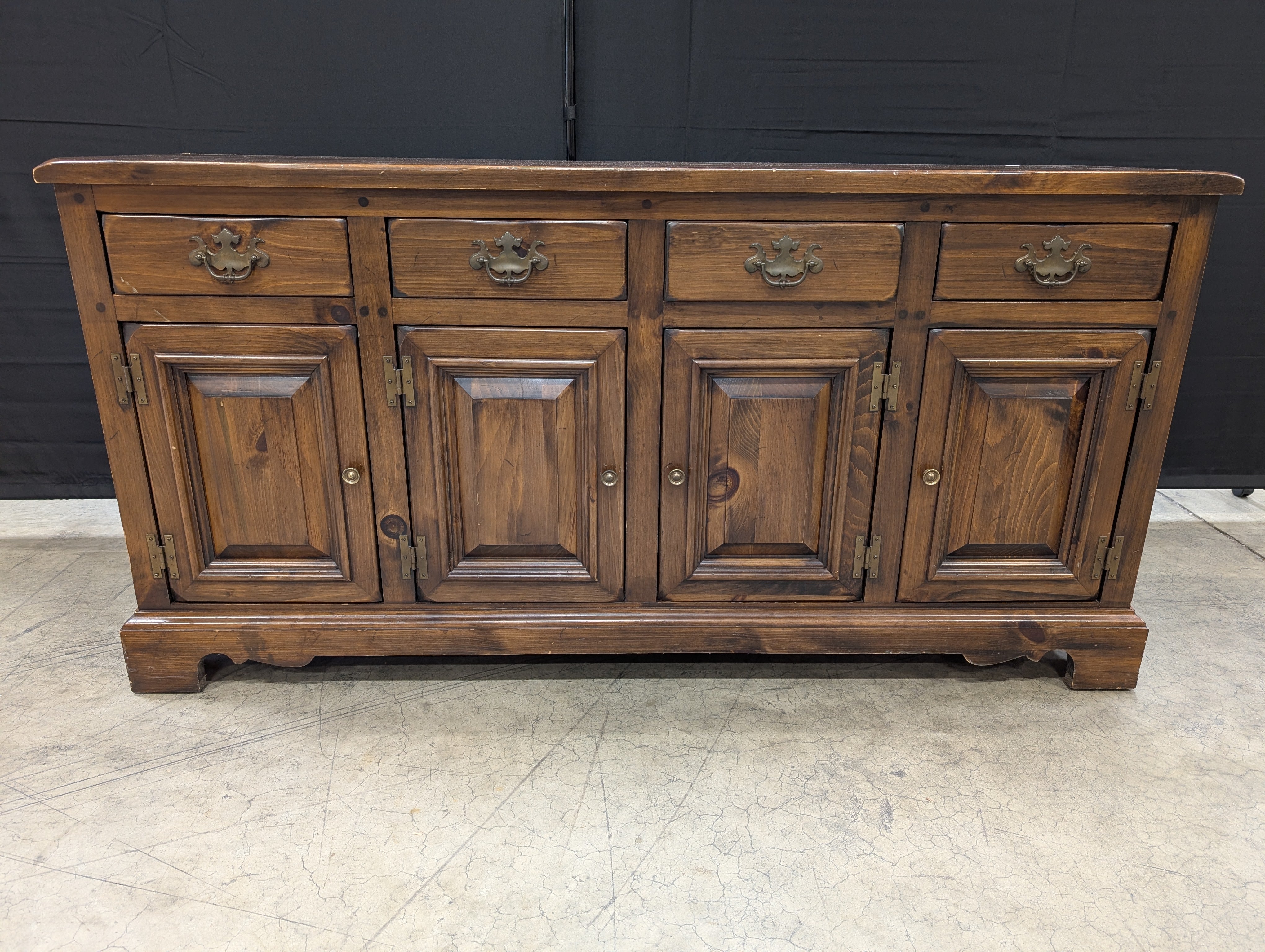 Rustic Dark Stained Wood Sideboard with Ornate Hardware