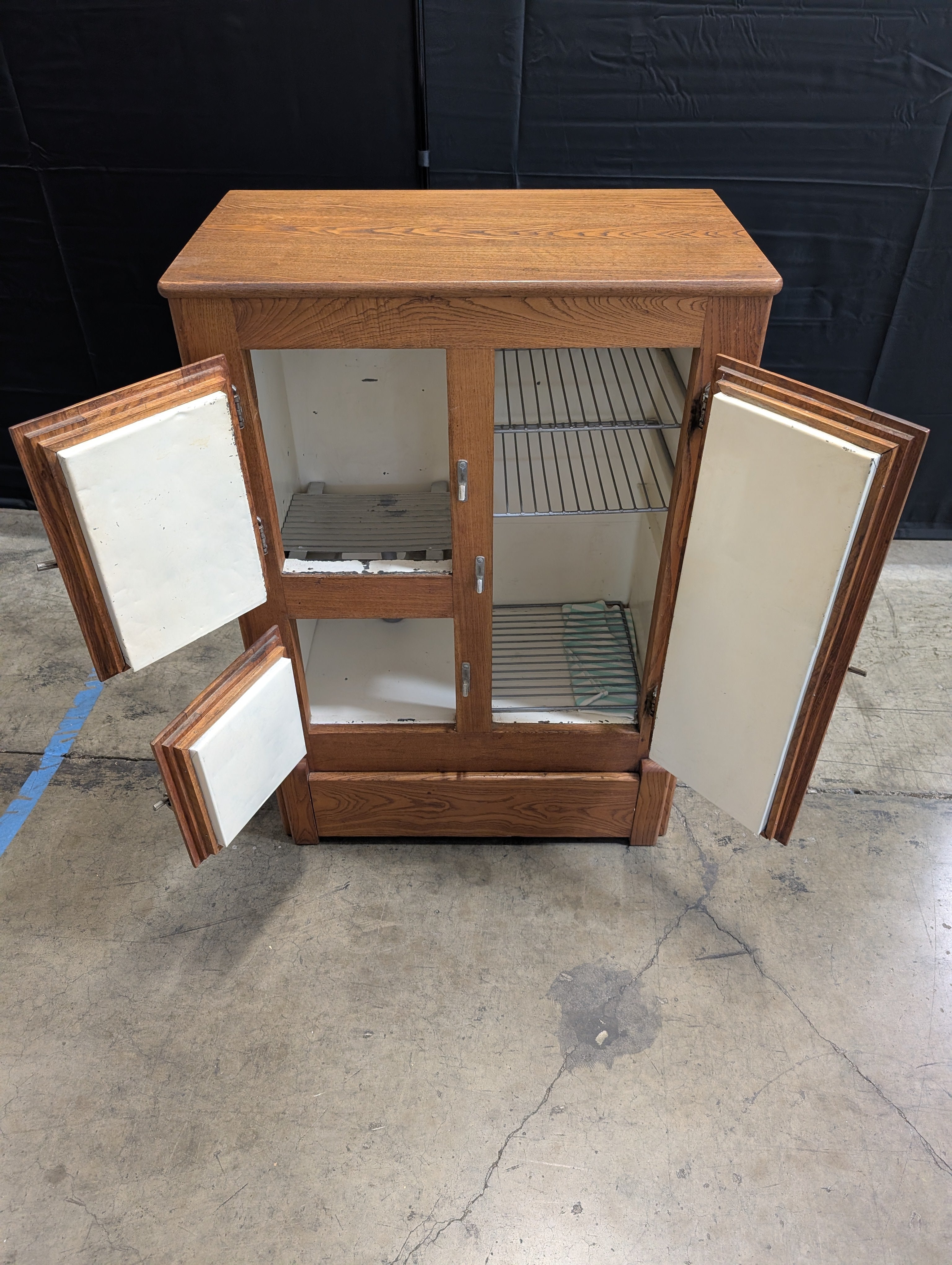 Rustic Wood Storage Cabinet with Paneled Doors and Metal Latches
