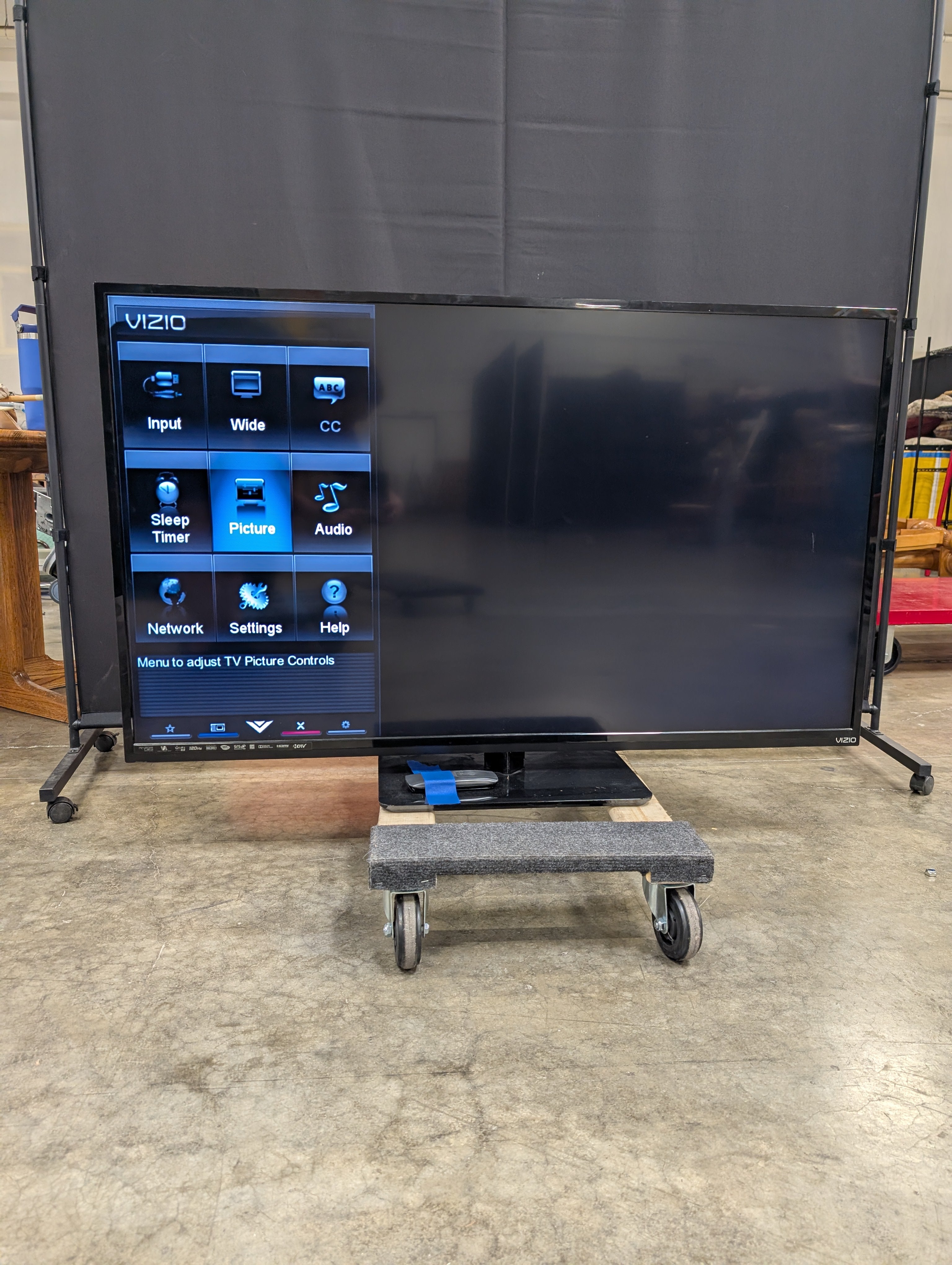 Black Flat Panel TV with Stand