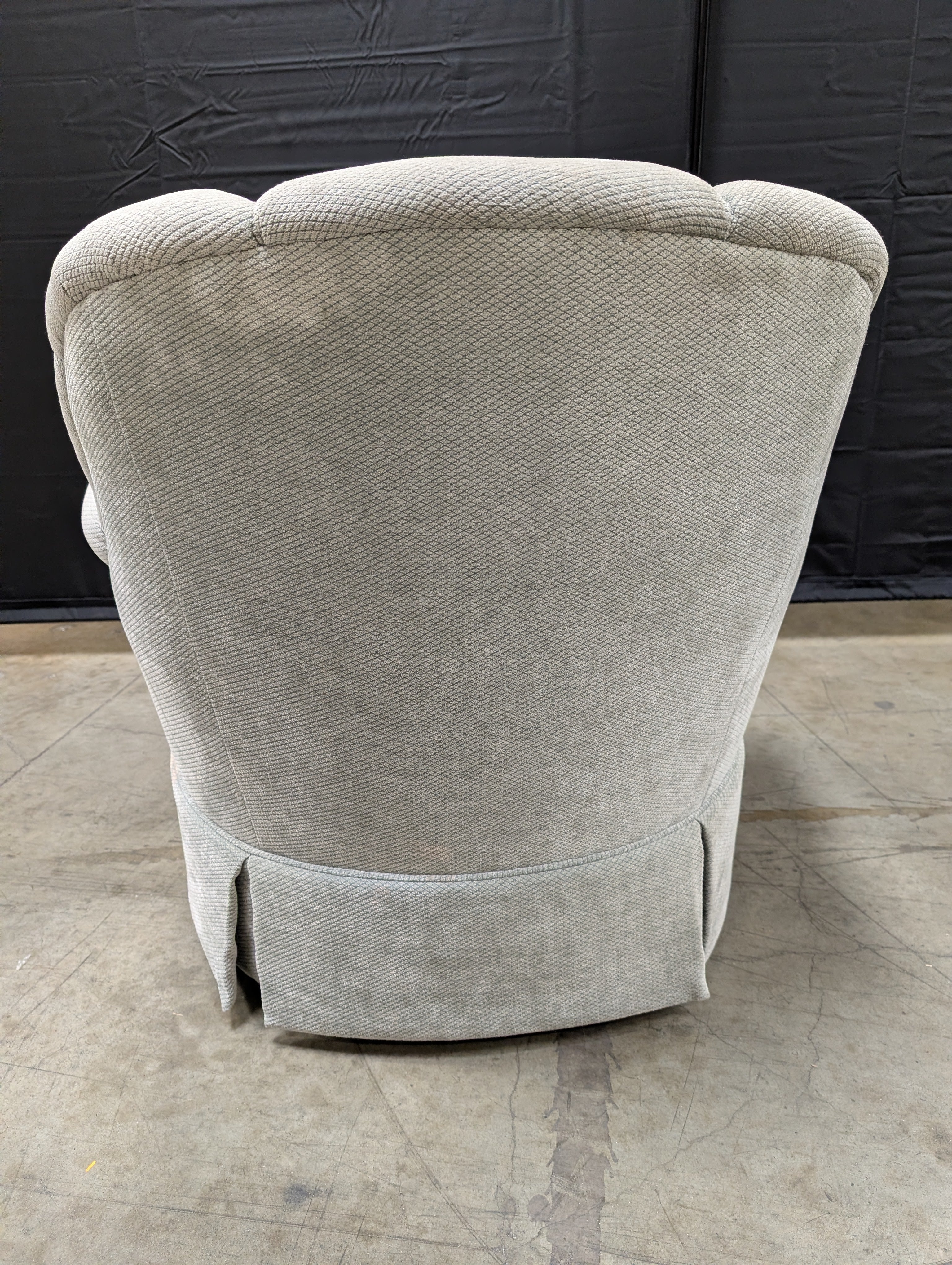 Textured Upholstered Scalloped Back Swivel Armchair