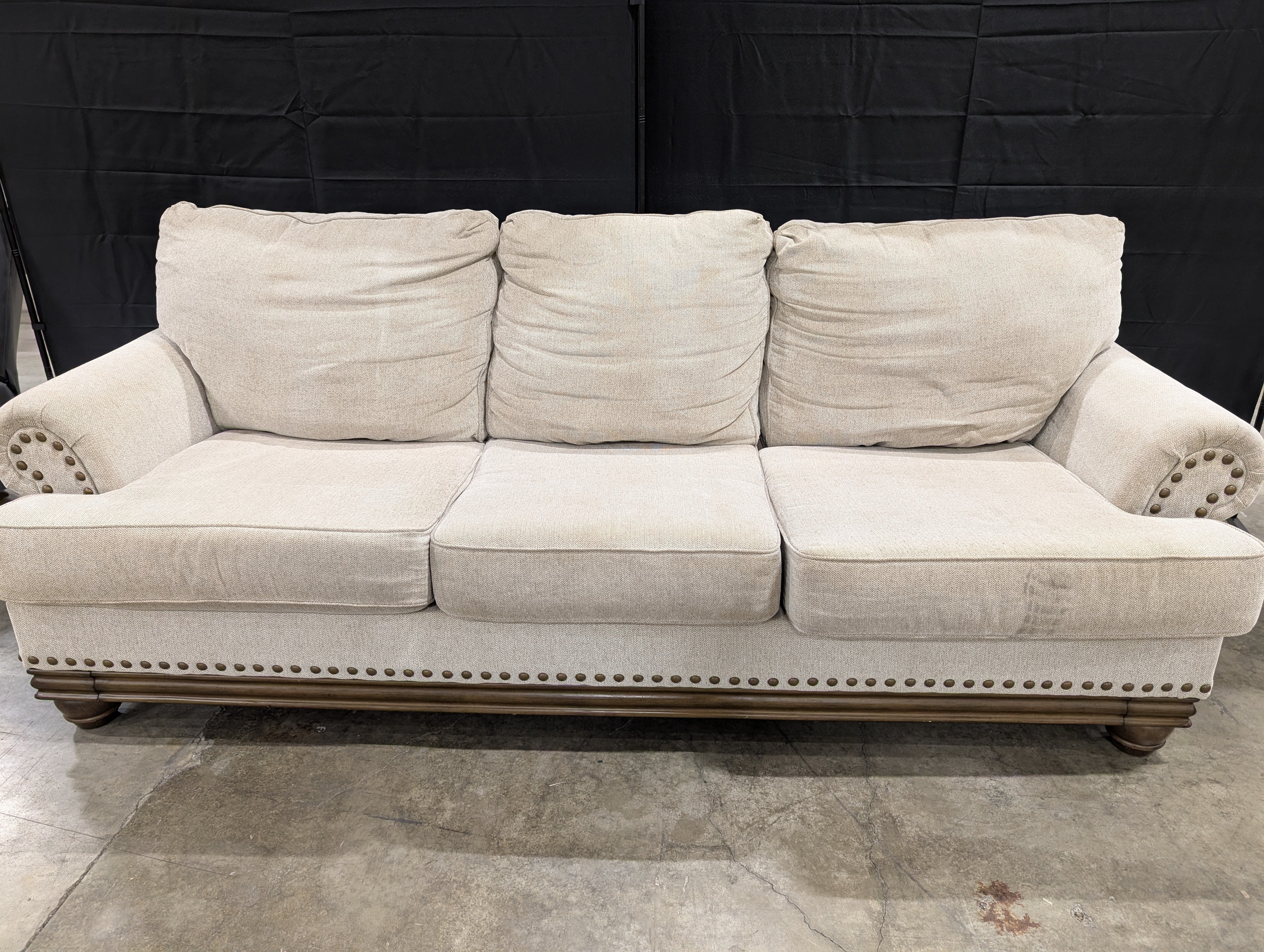 Neutral Three-Cushion Nail Trim Sofa