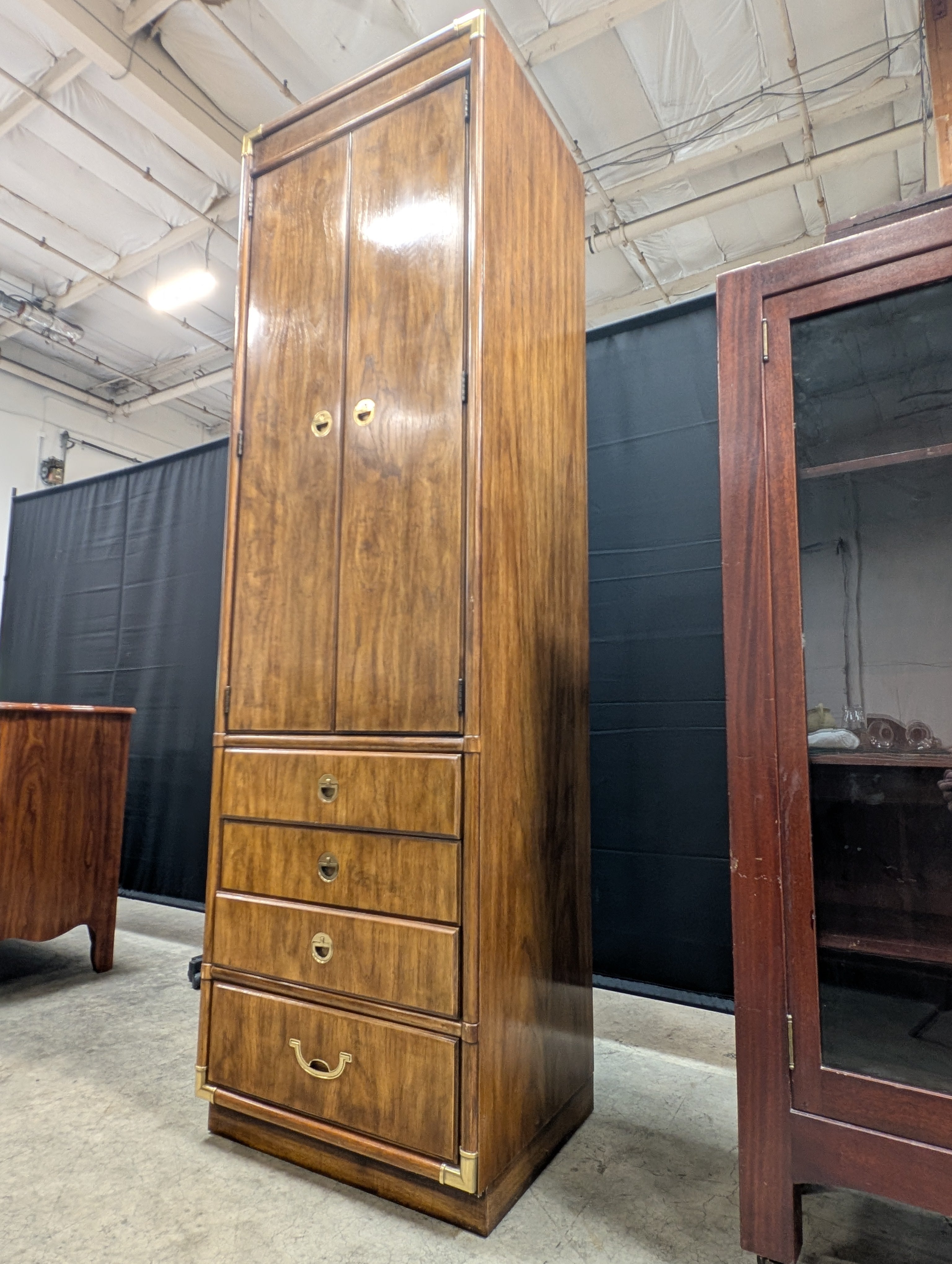 Tall Wooden Drexel Cabinet with Brass Accents and Multiple Drawers
