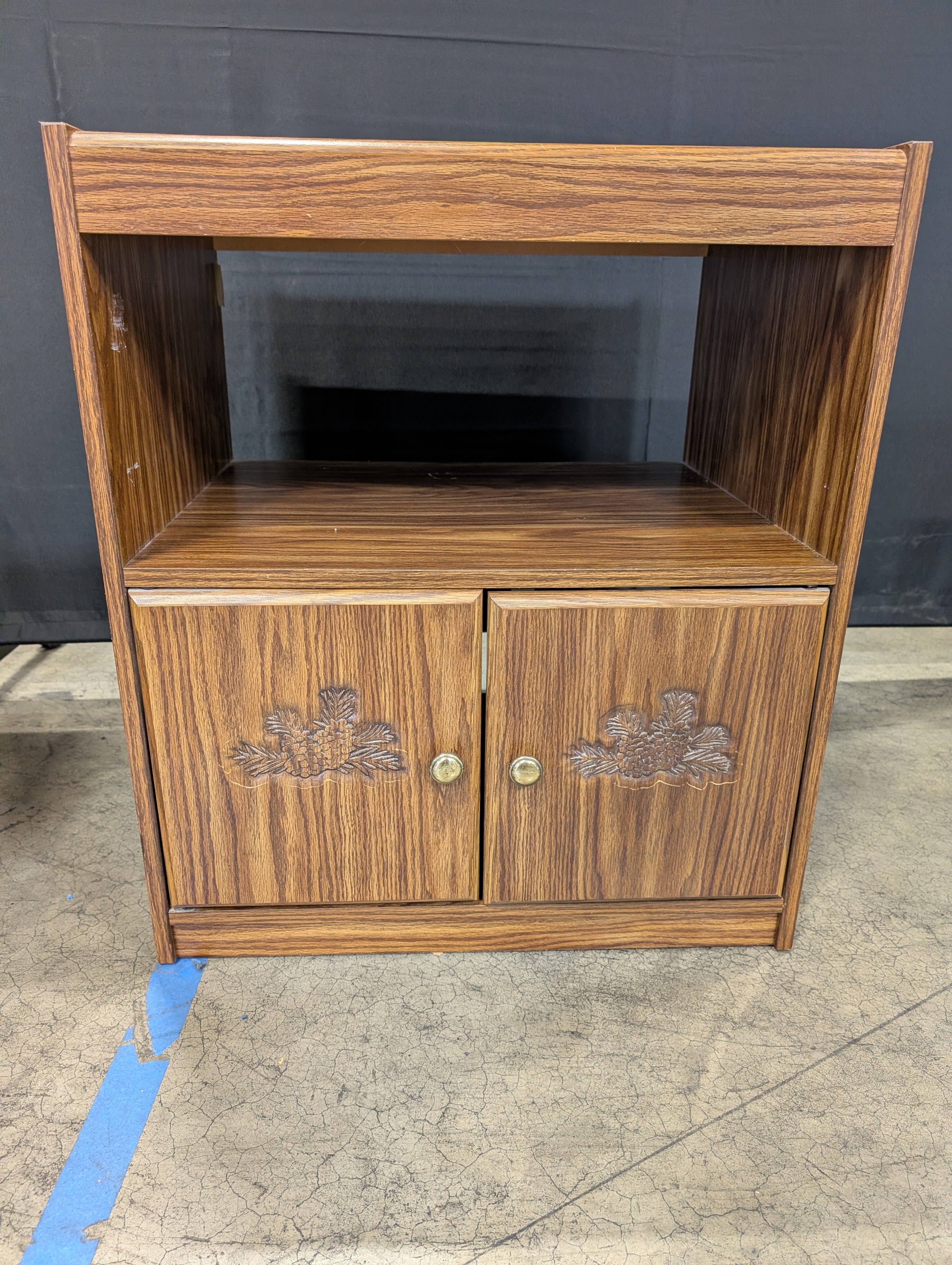 Rolling Brown Wood-Look Accent Cabinet with Carved Doors