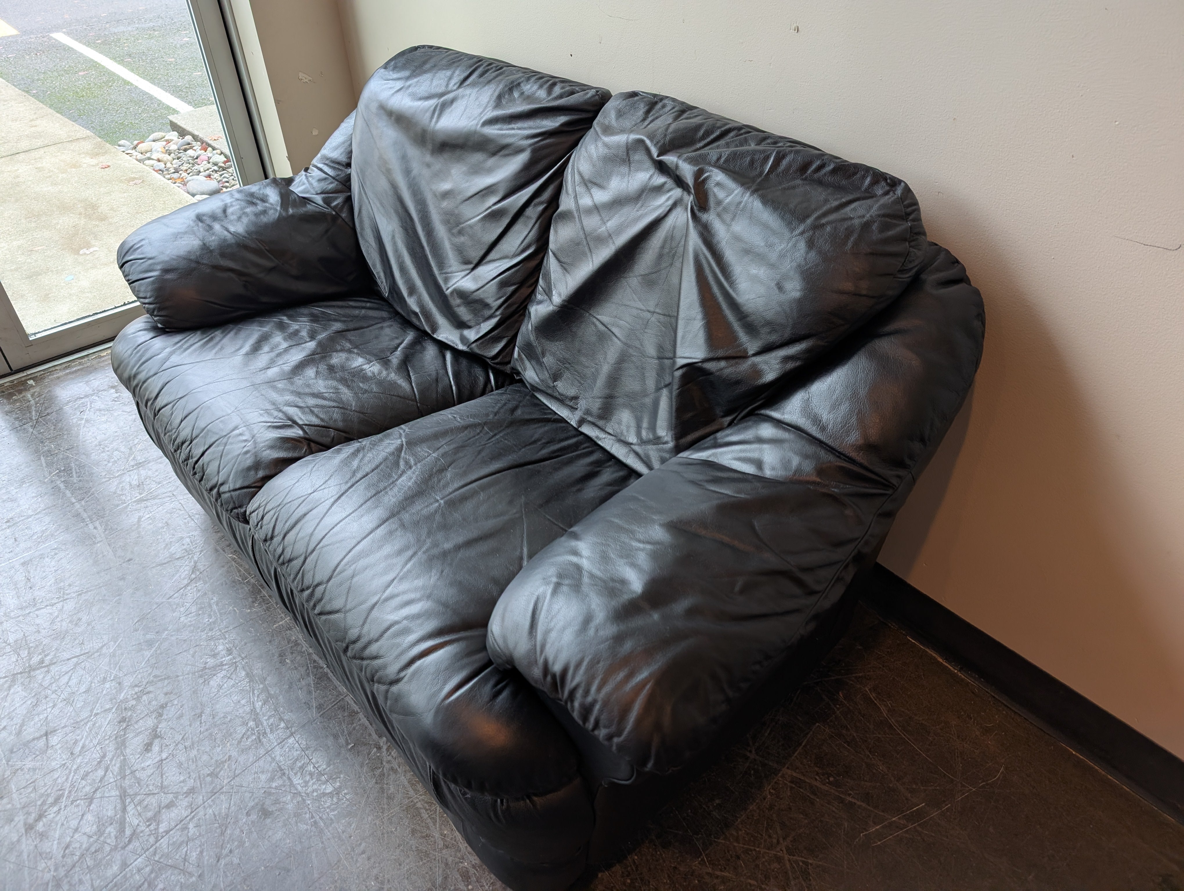 Spacious Black Leather Loveseat