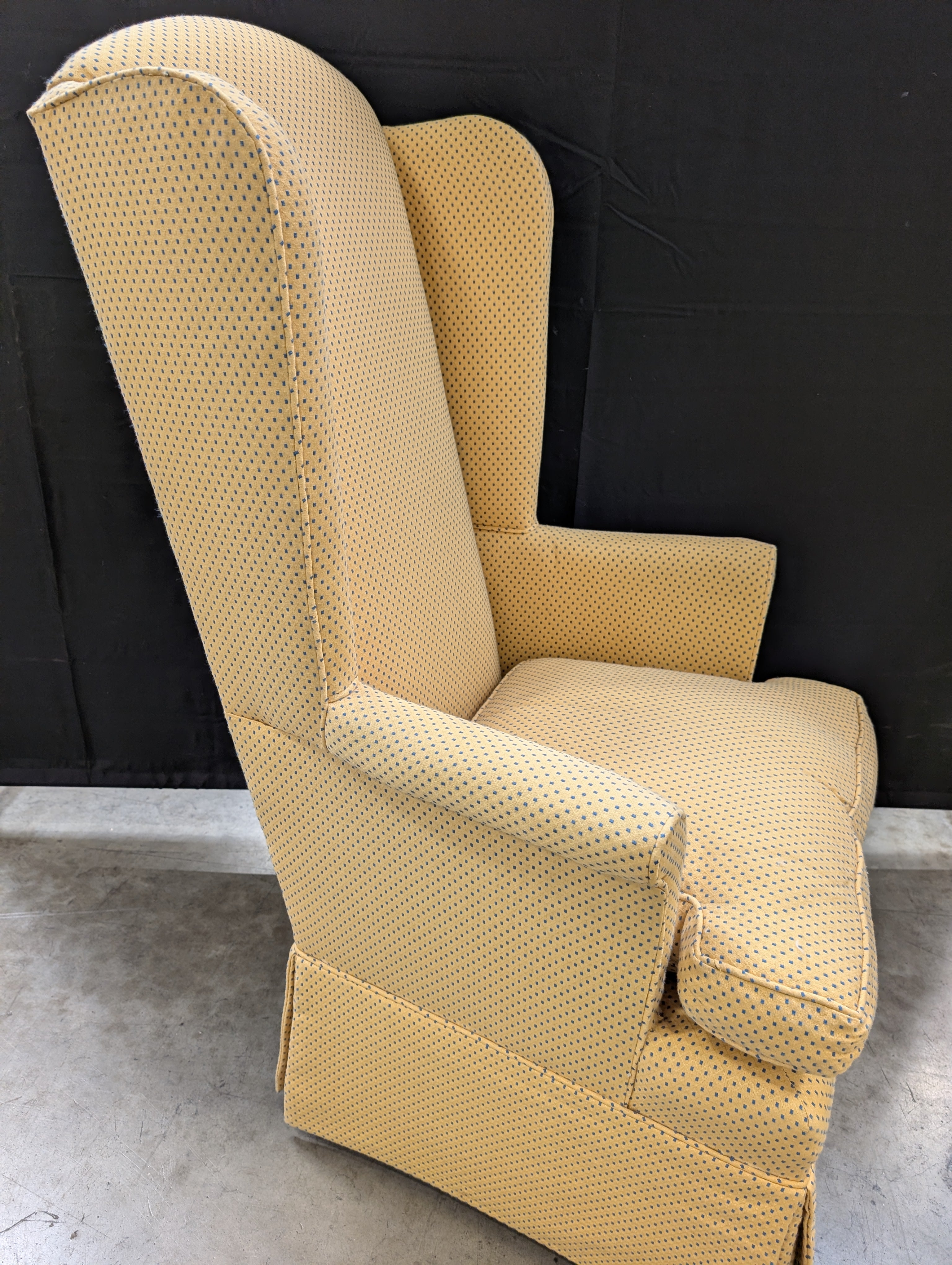 Yellow Wingback Armchair with Skirted Base