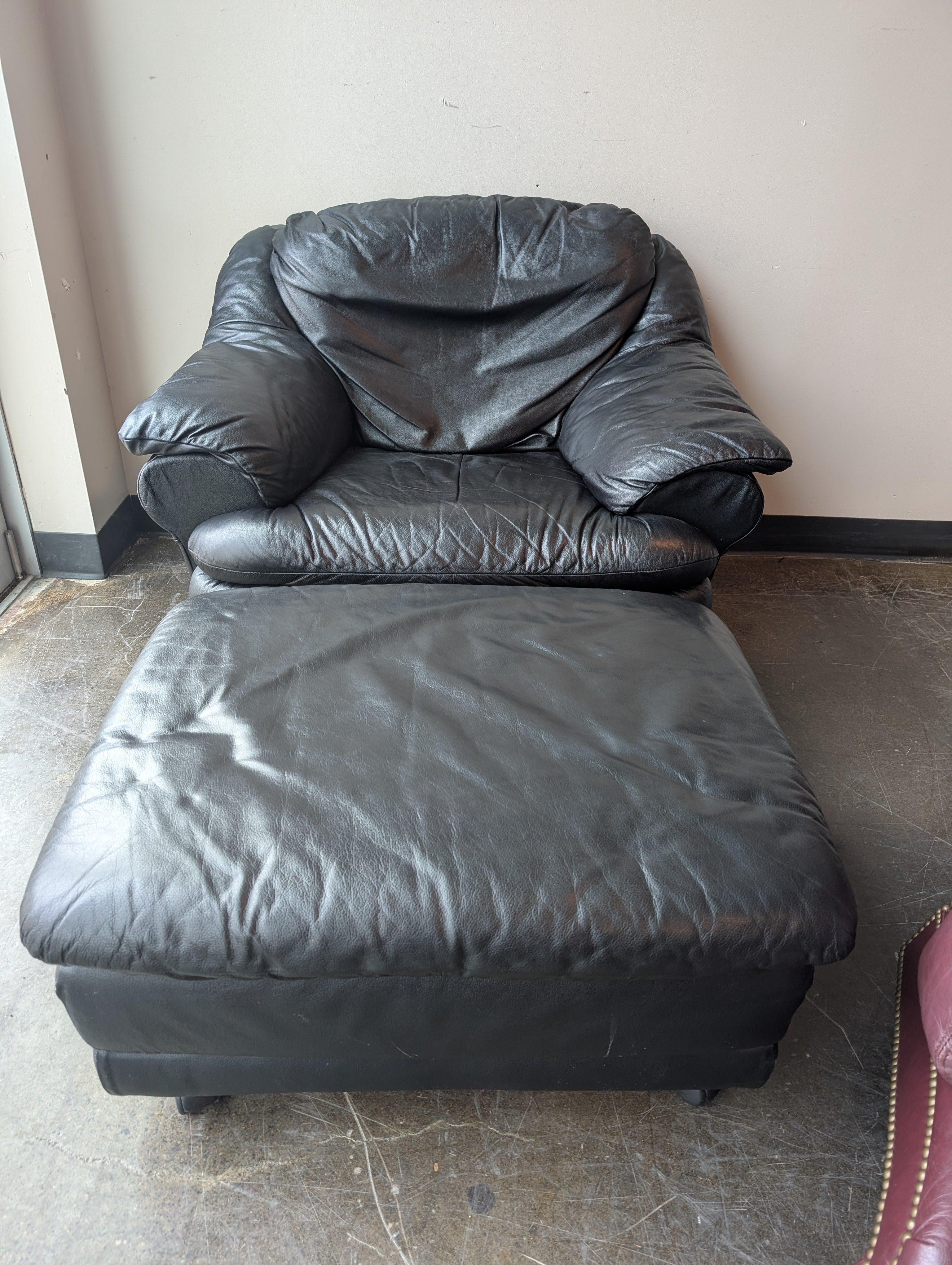 Plush Black Leather Armchair and Ottoman Set