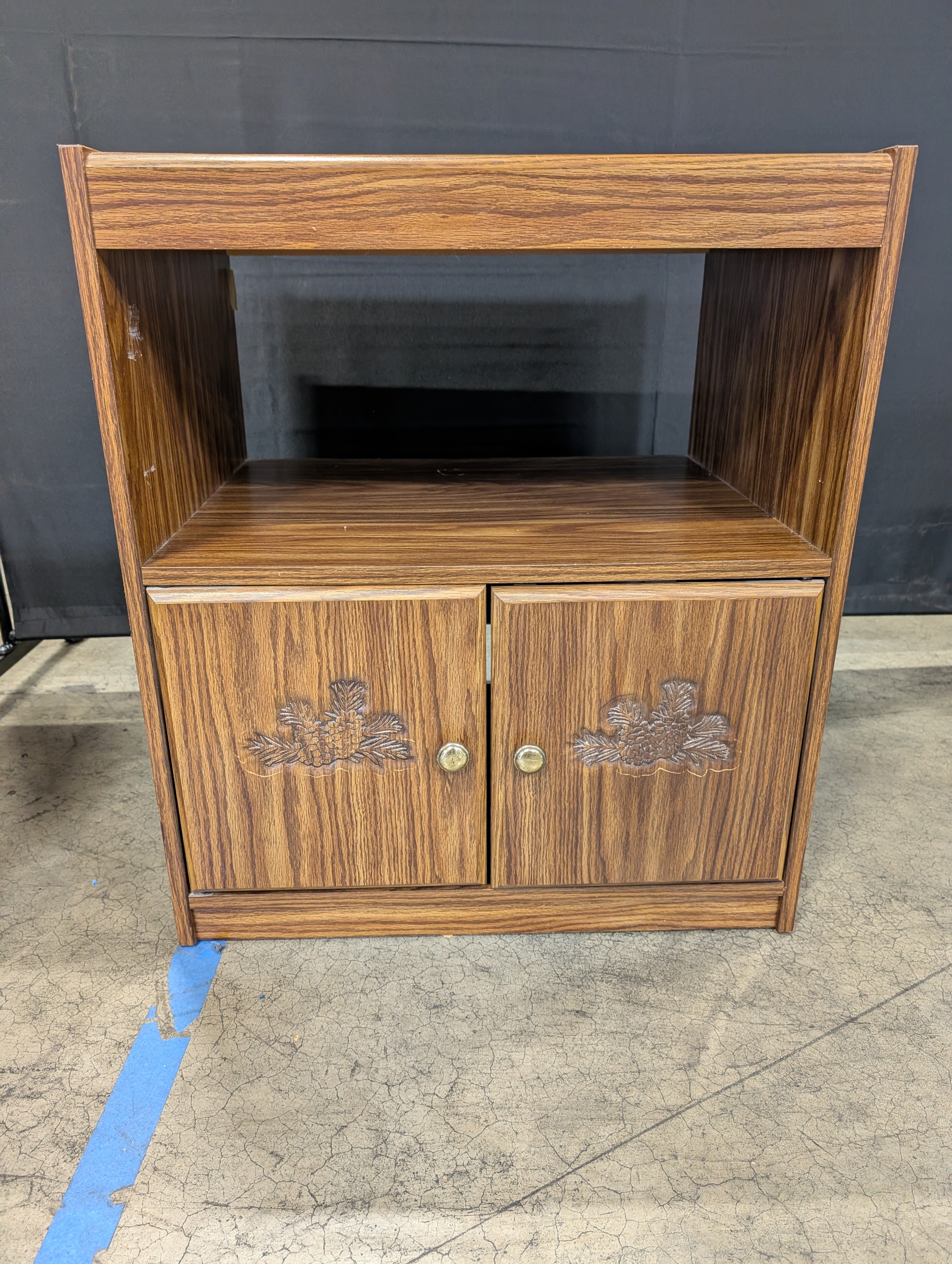 Rolling Brown Wood-Look Accent Cabinet with Carved Doors