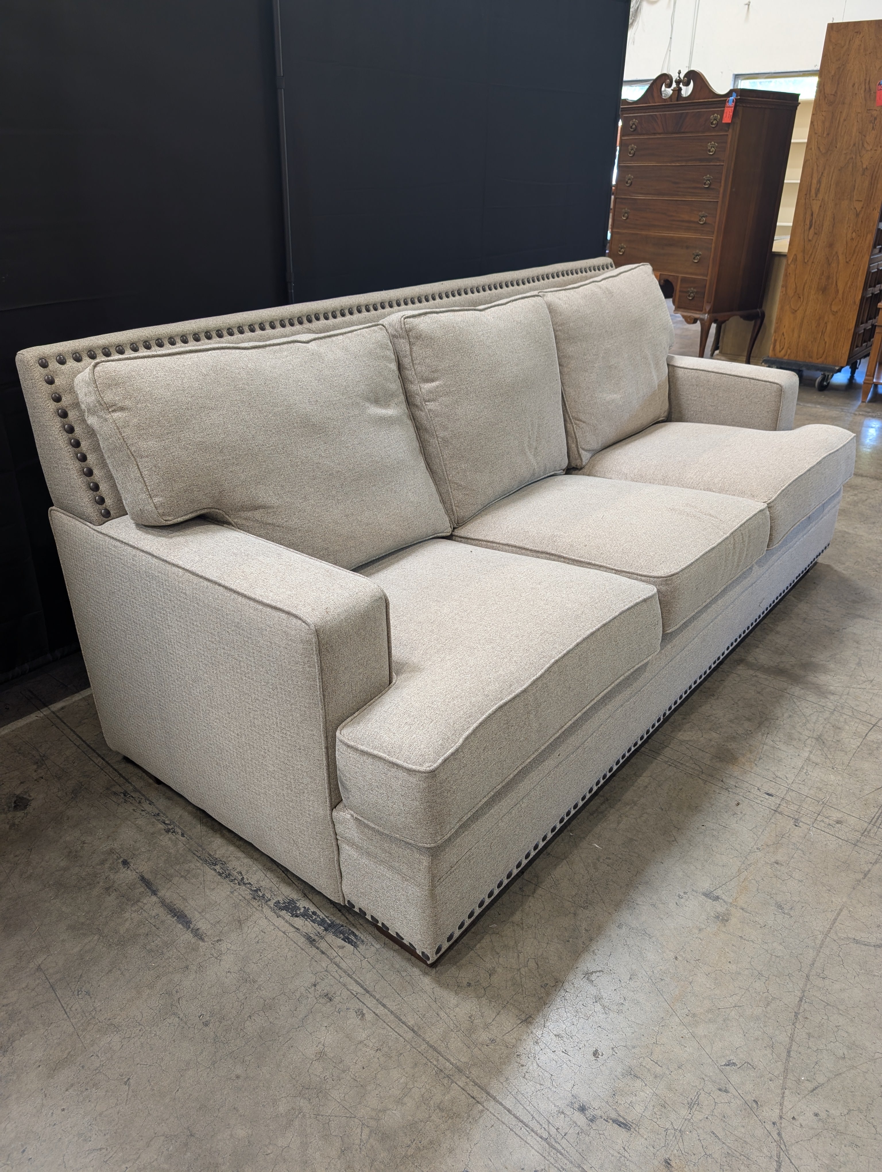 Grey Fabric Three-Seat Couch with Nailhead Trim