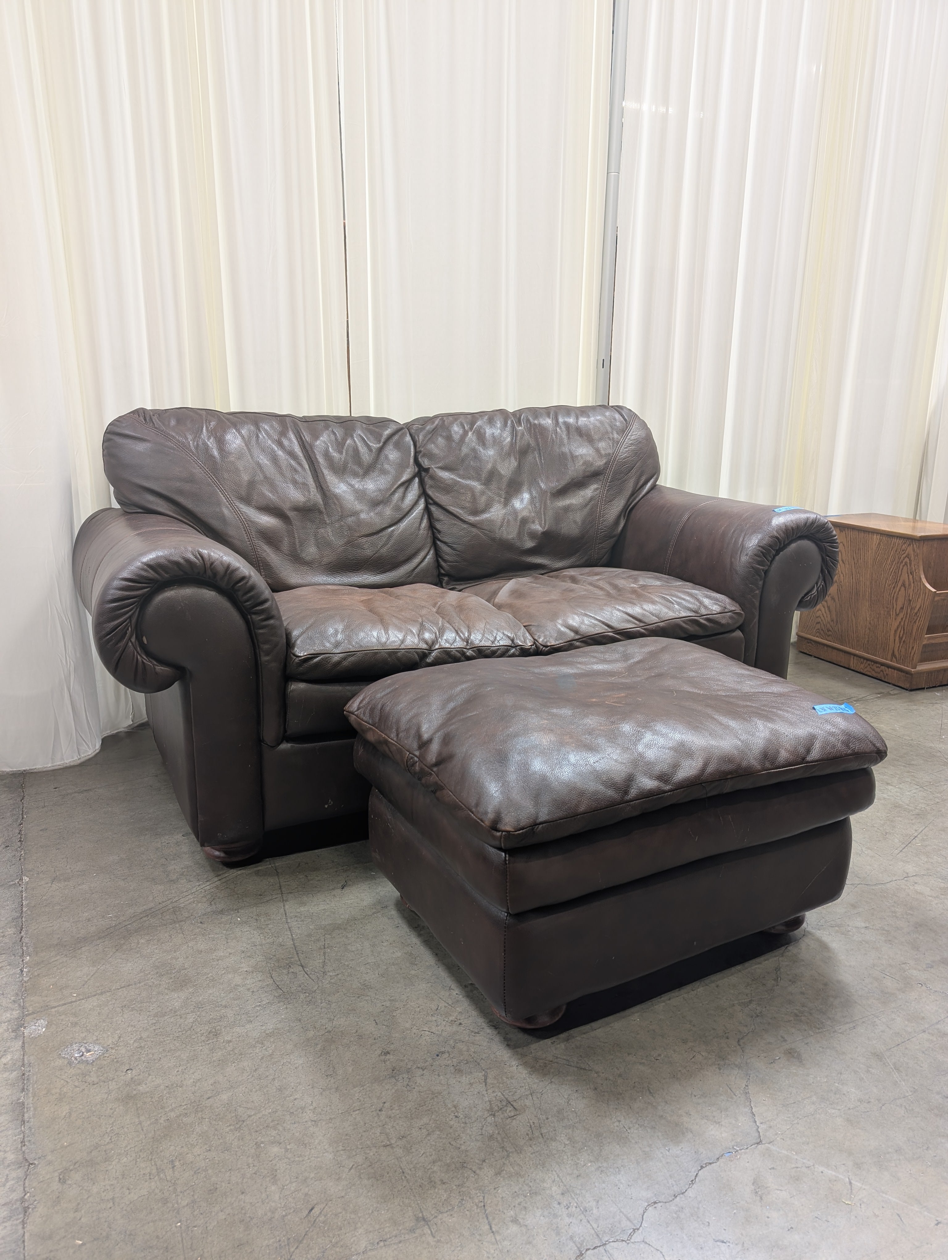 Dark Brown Leather Rolled Arm Couch with matching Ottoman