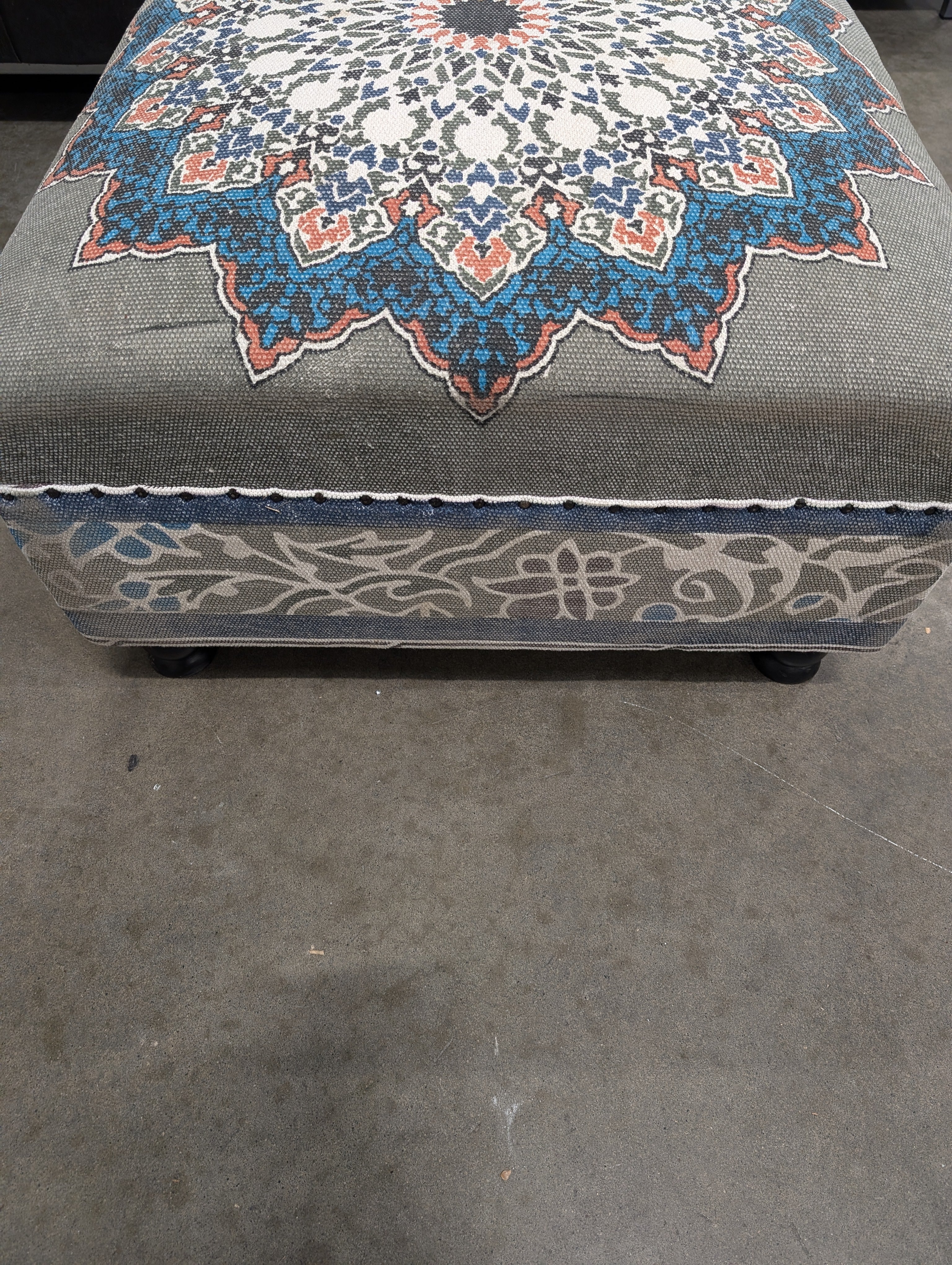 Decorative Upholstered Ottoman with Medallion Pattern and Nailhead Trim