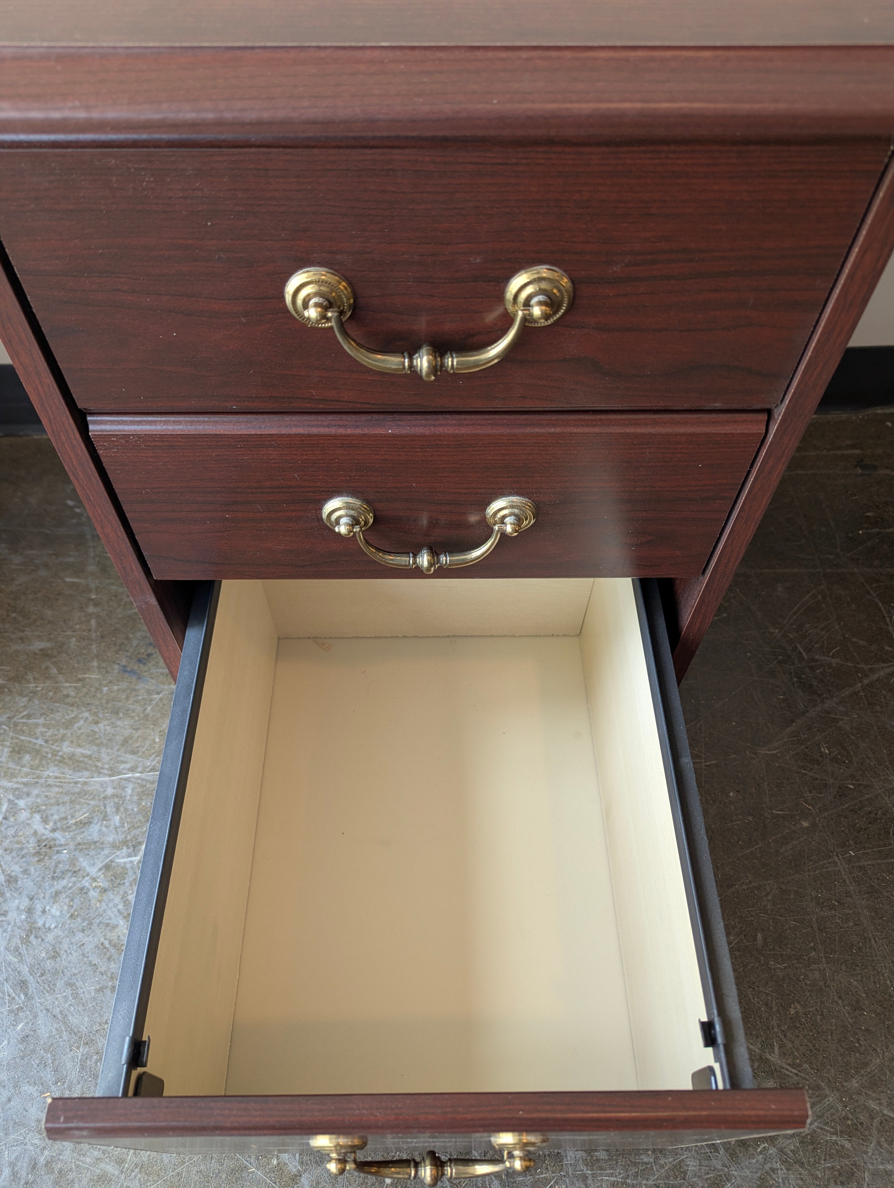 Compact Dark Wood Three-Drawer Storage Cabinet