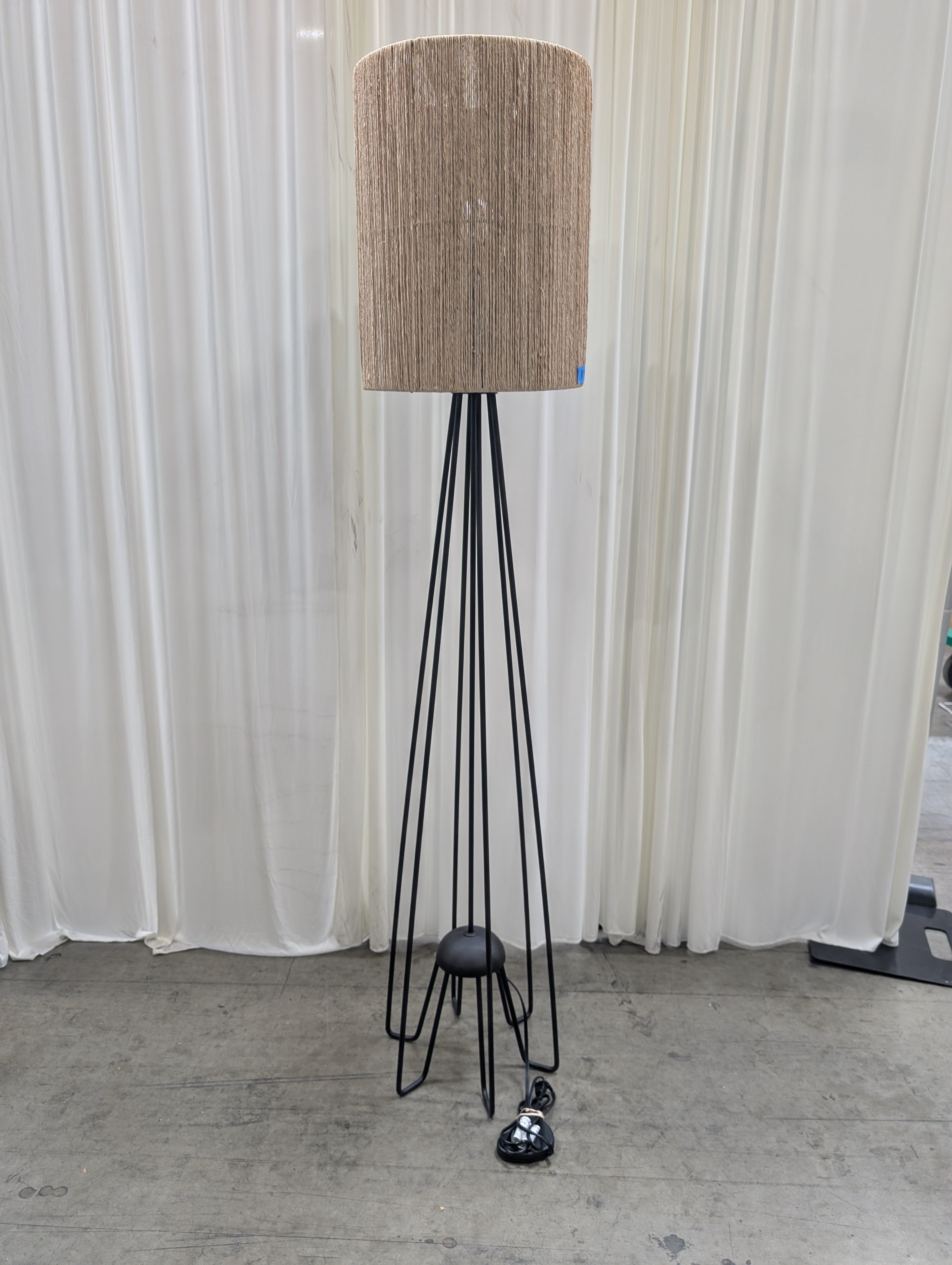 Contemporary Black Metal Tripod Floor Lamp with Natural Fiber Shade