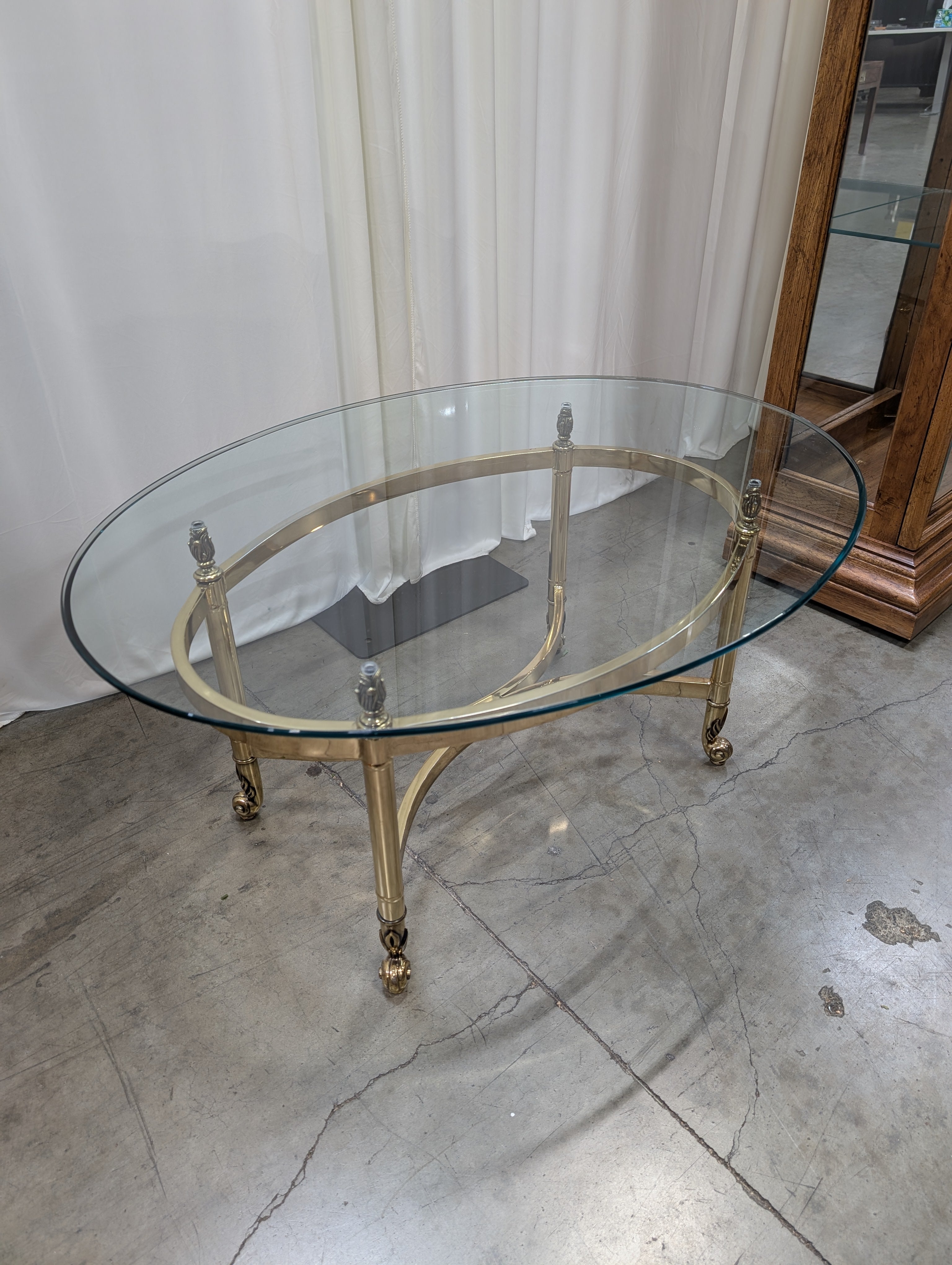Oval Glass Top Coffee Table with Casters
