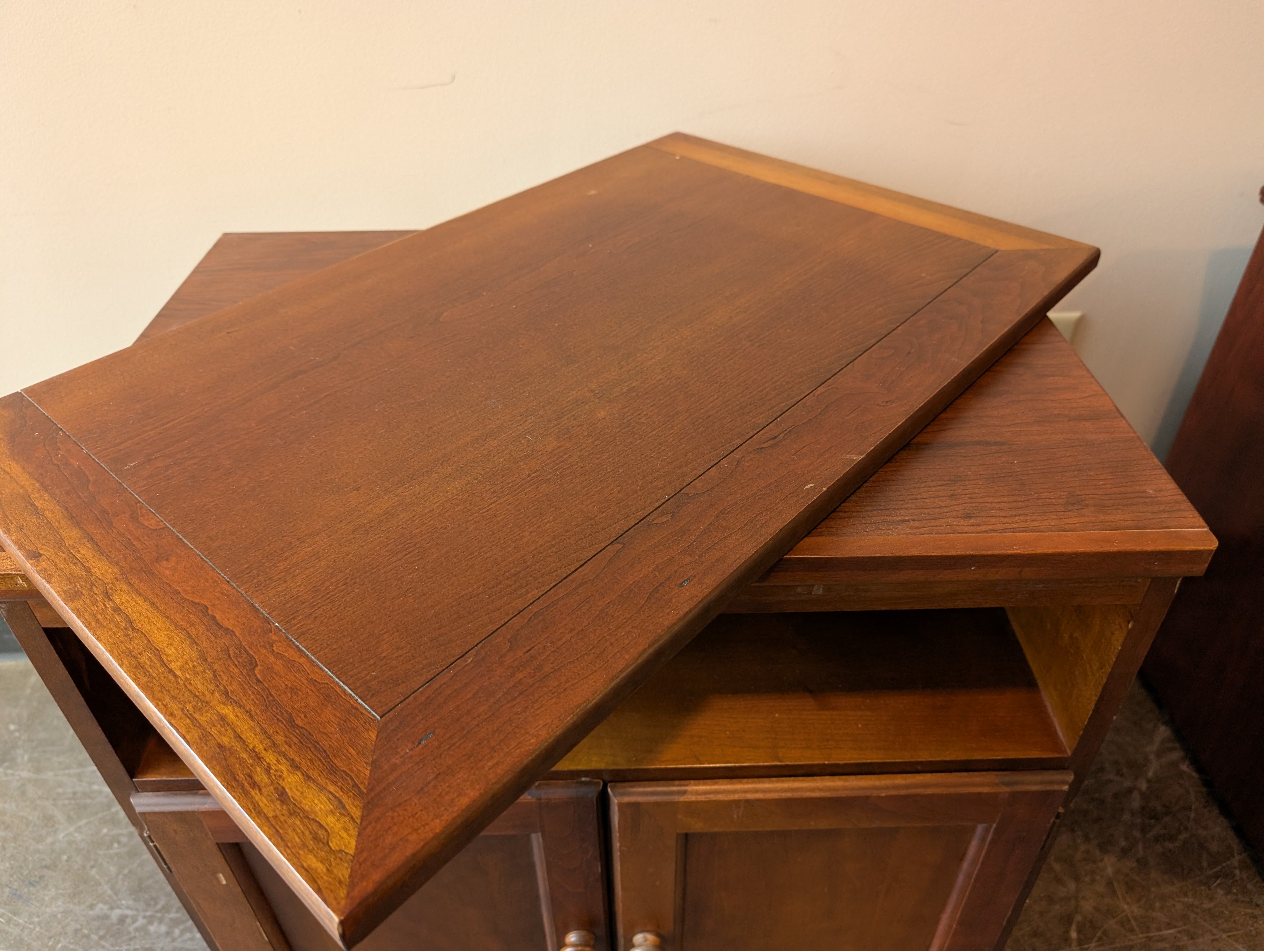 Compact Brown Wood Storage Cabinet with Spinning Top