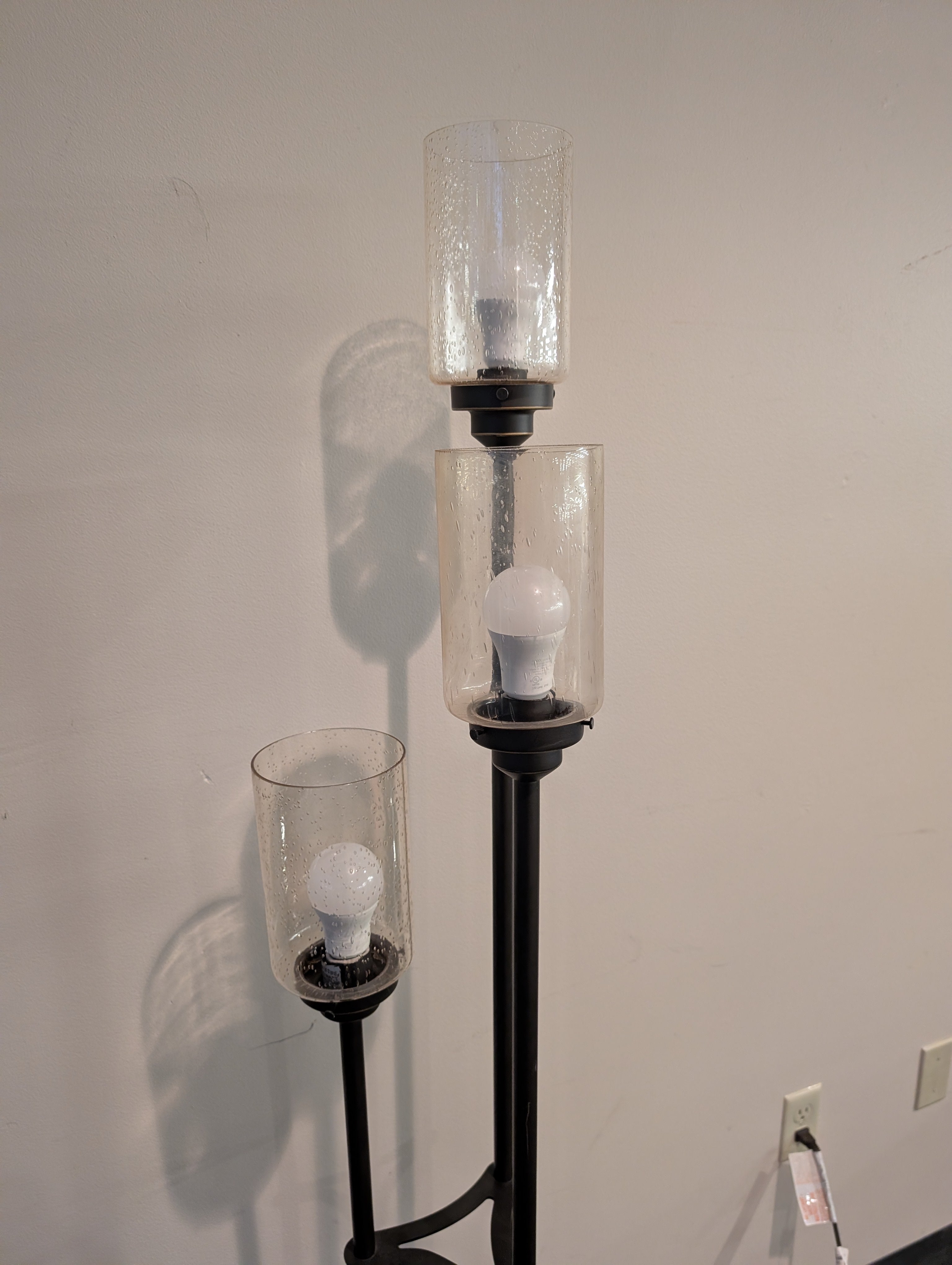 Contemporary Black Metal Three-Light Floor Lamp with Textured Glass Shades