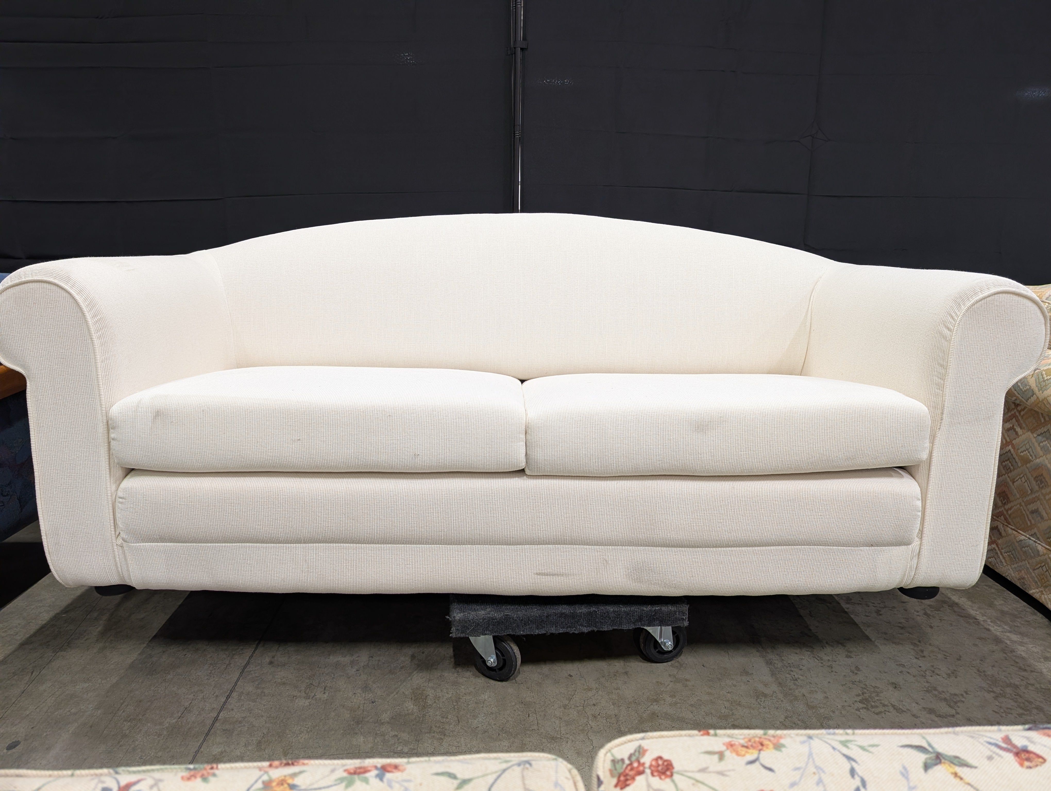 Cream-Colored Two-Seater Sofa