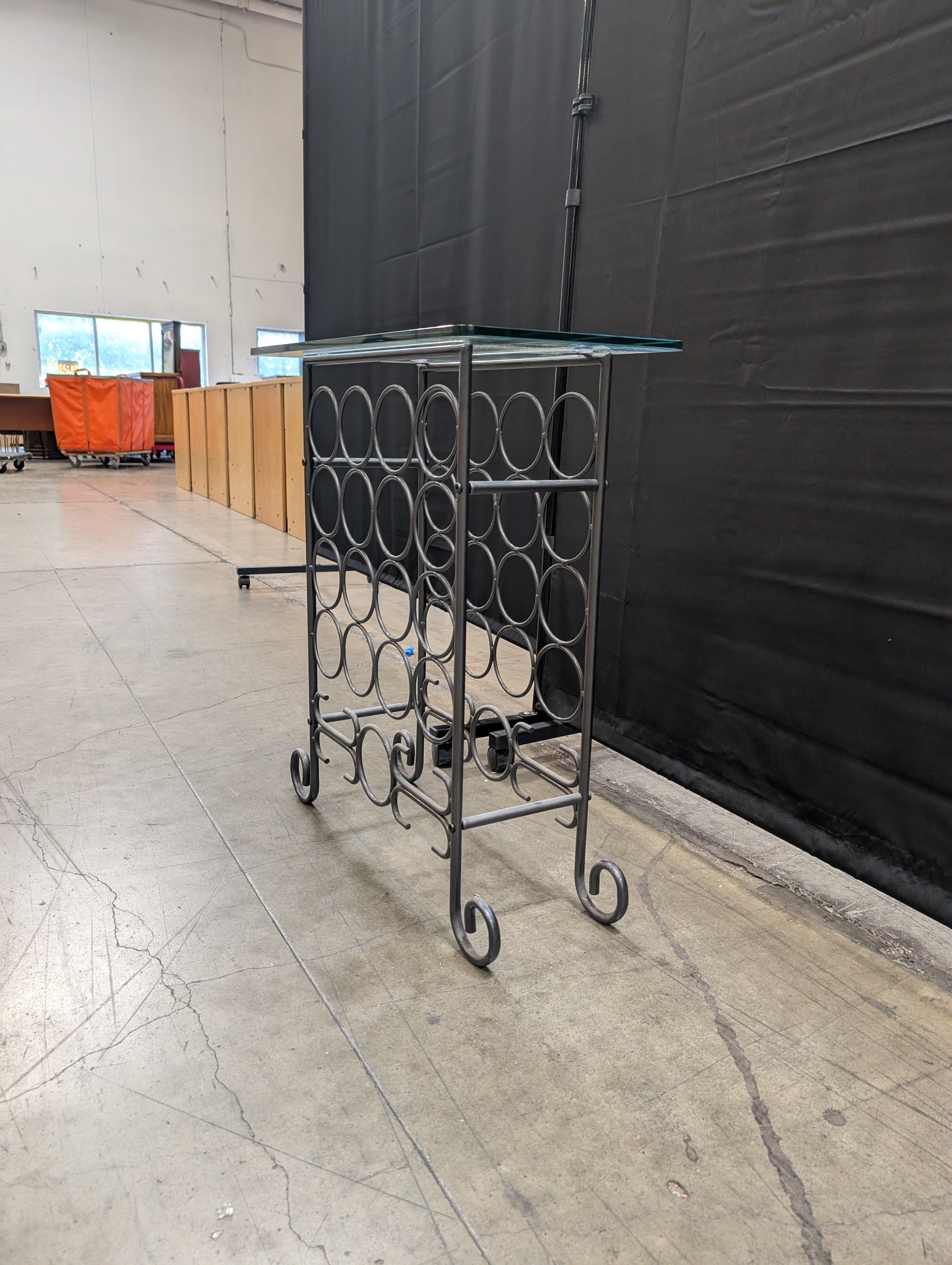 Industrial Style Metal Wine Rack with Glass Top and Wheels