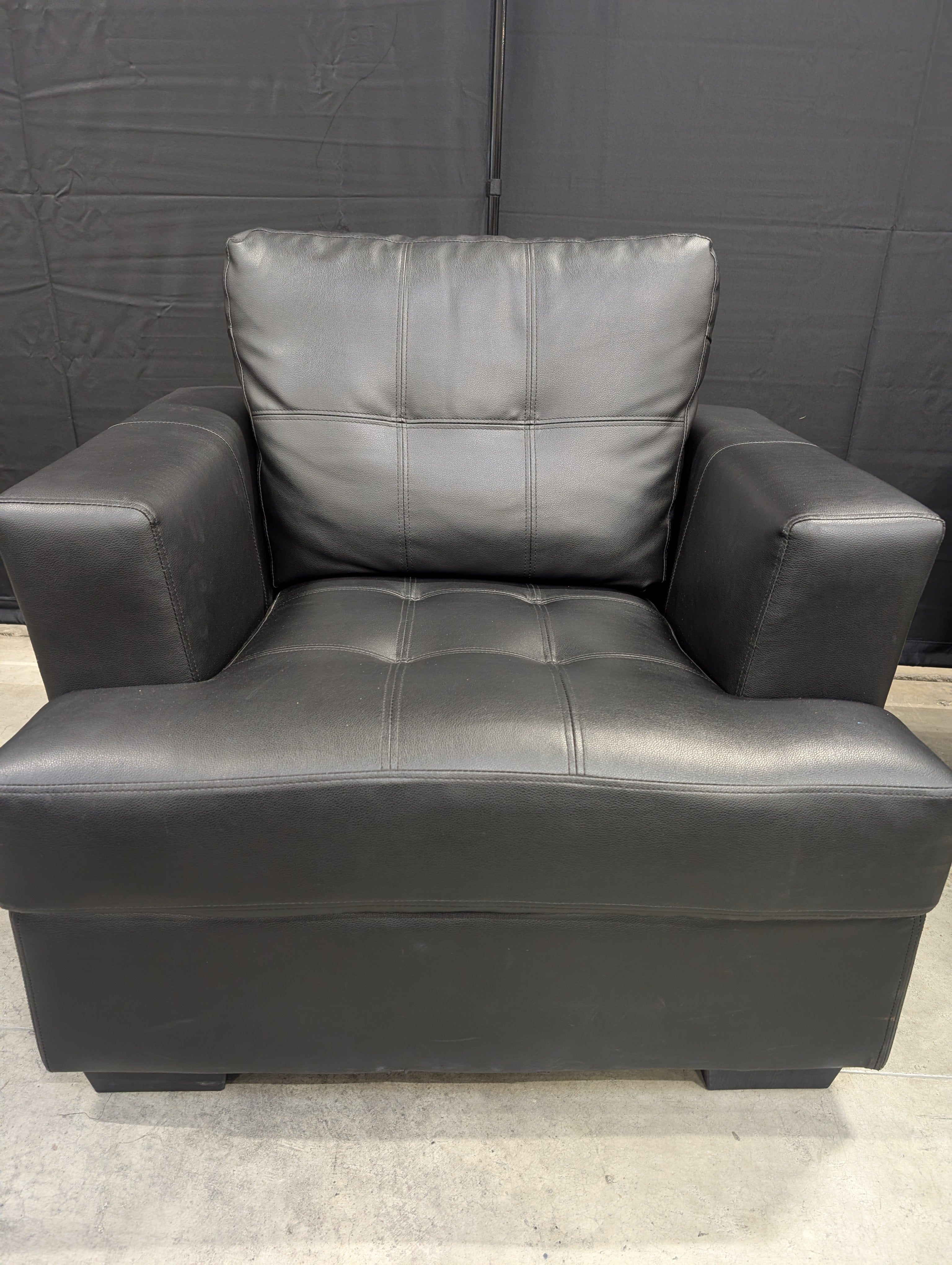 Contemporary Black Armchair with Tufted Cushions