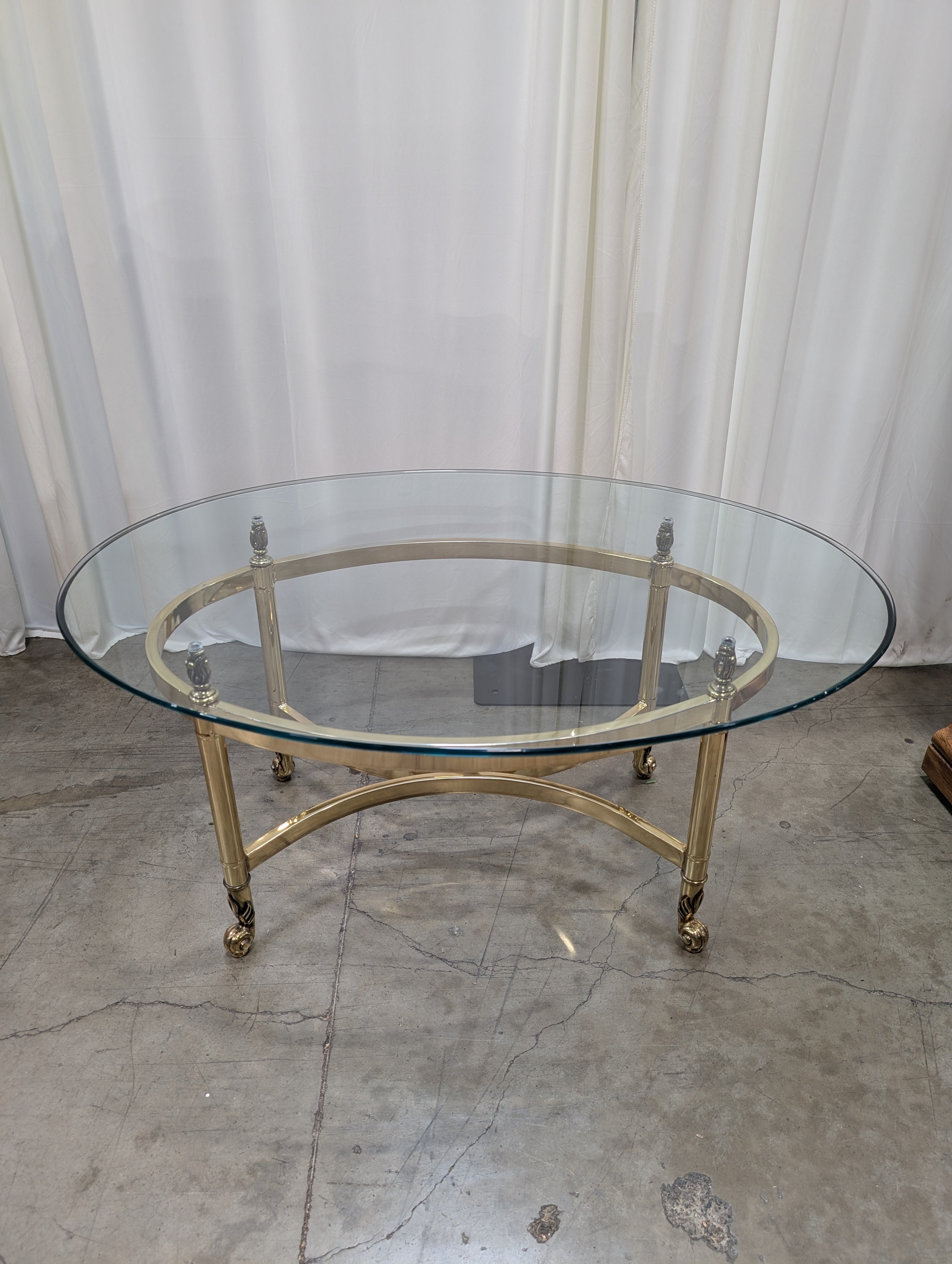 Oval Glass Top Coffee Table with Casters