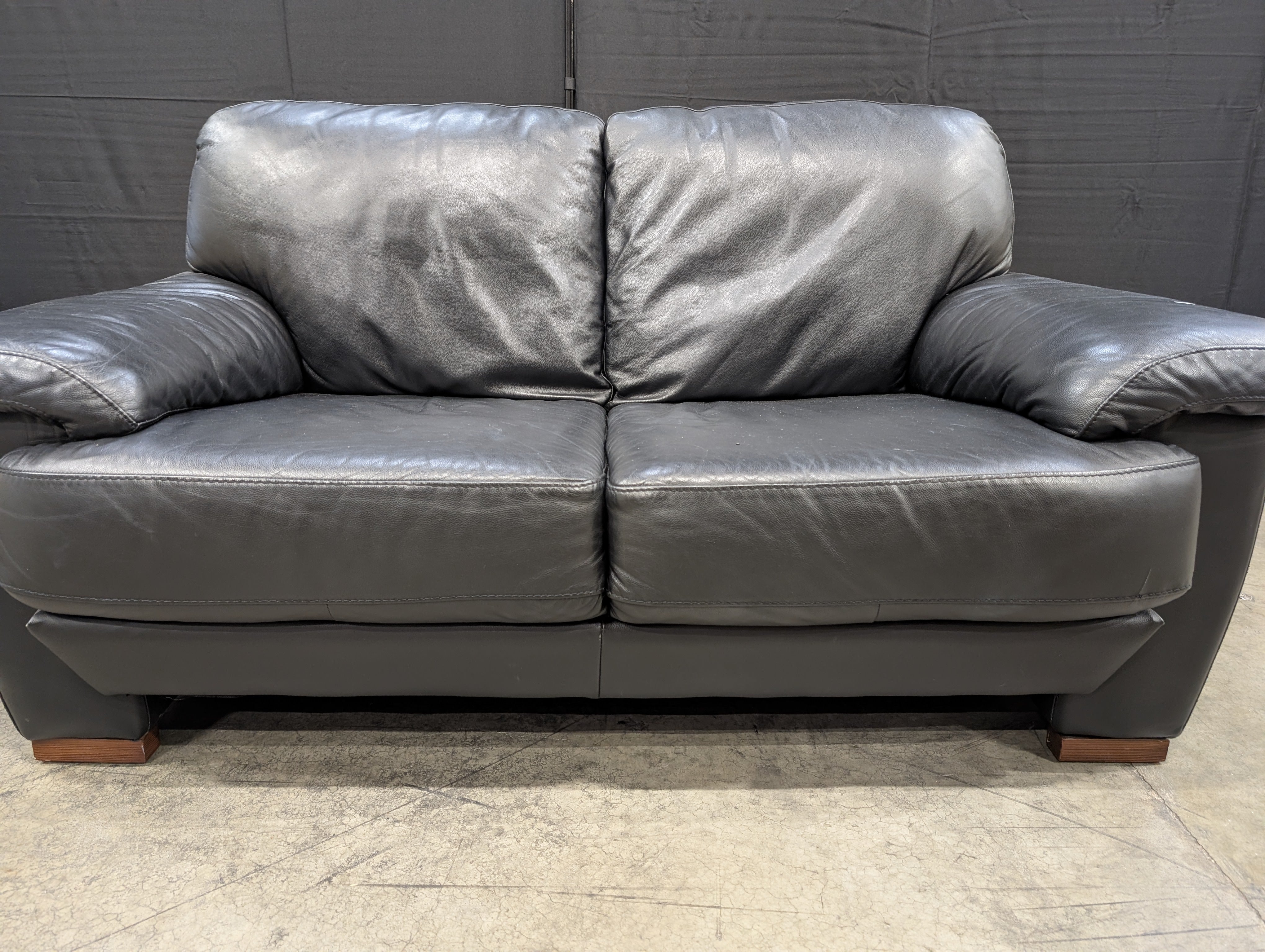 Modern Black Leather Two-Seater Sofa