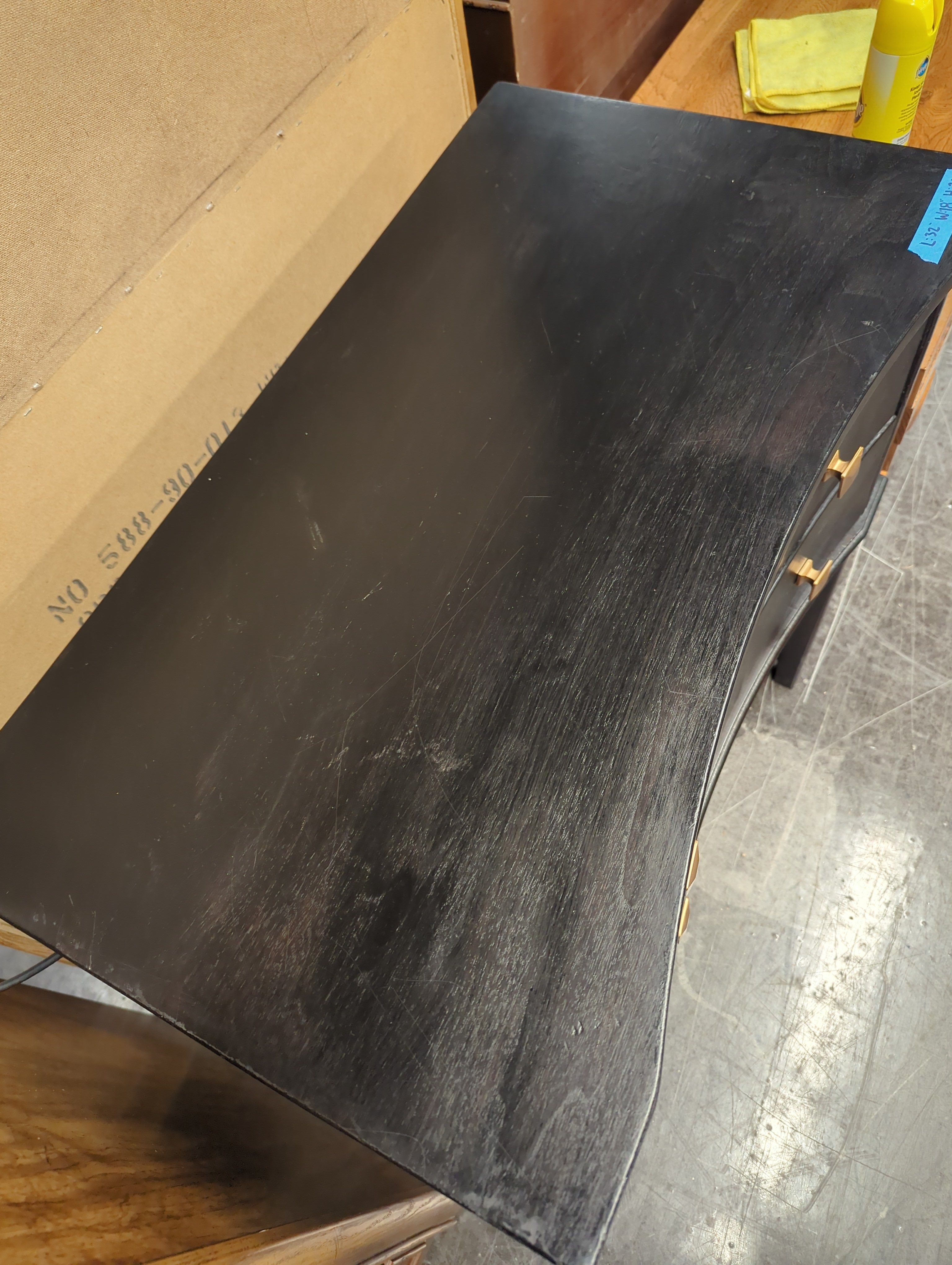 Black Curved Wood Nightstand with Gold Knobs