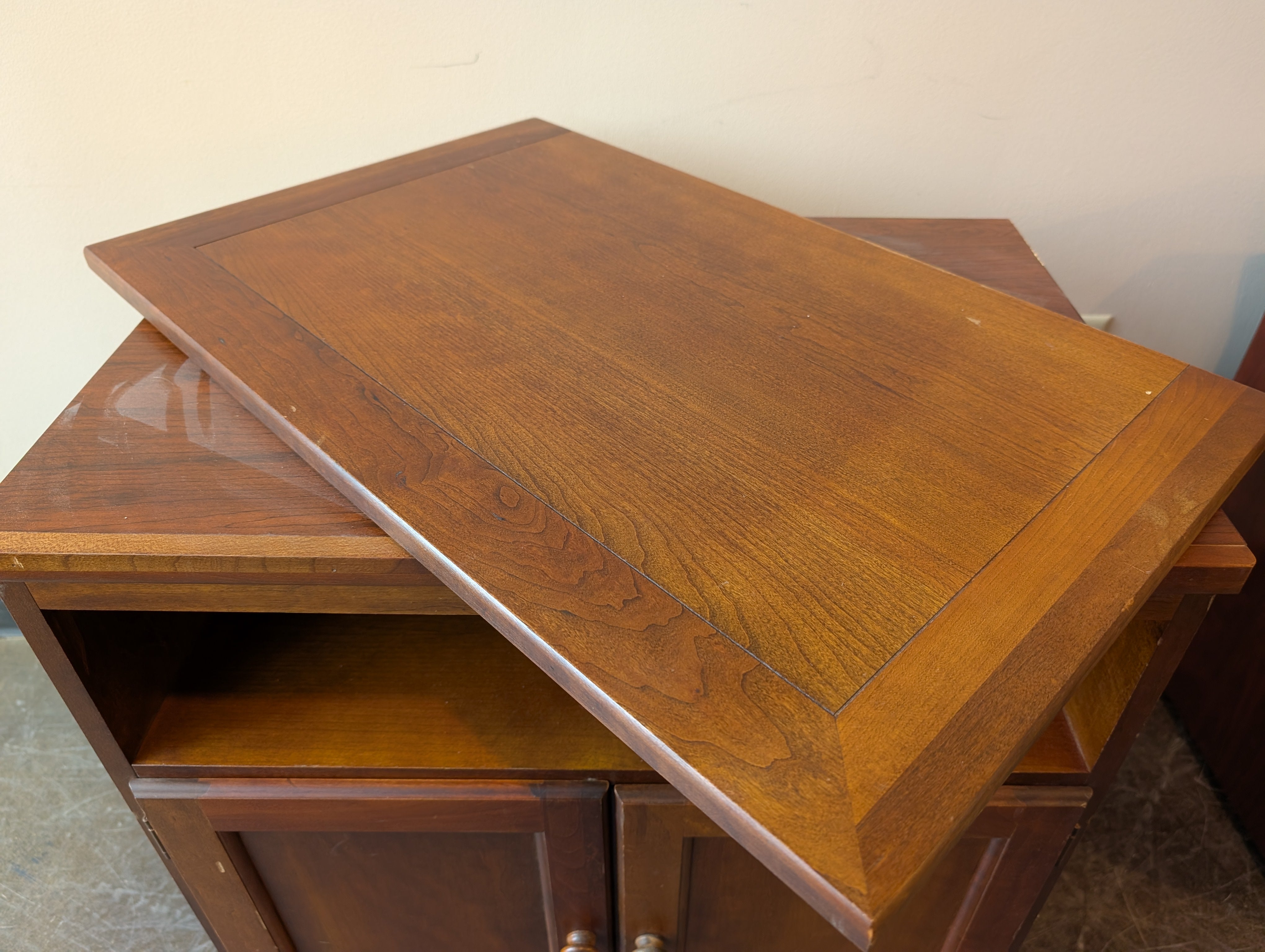 Compact Brown Wood Storage Cabinet with Spinning Top