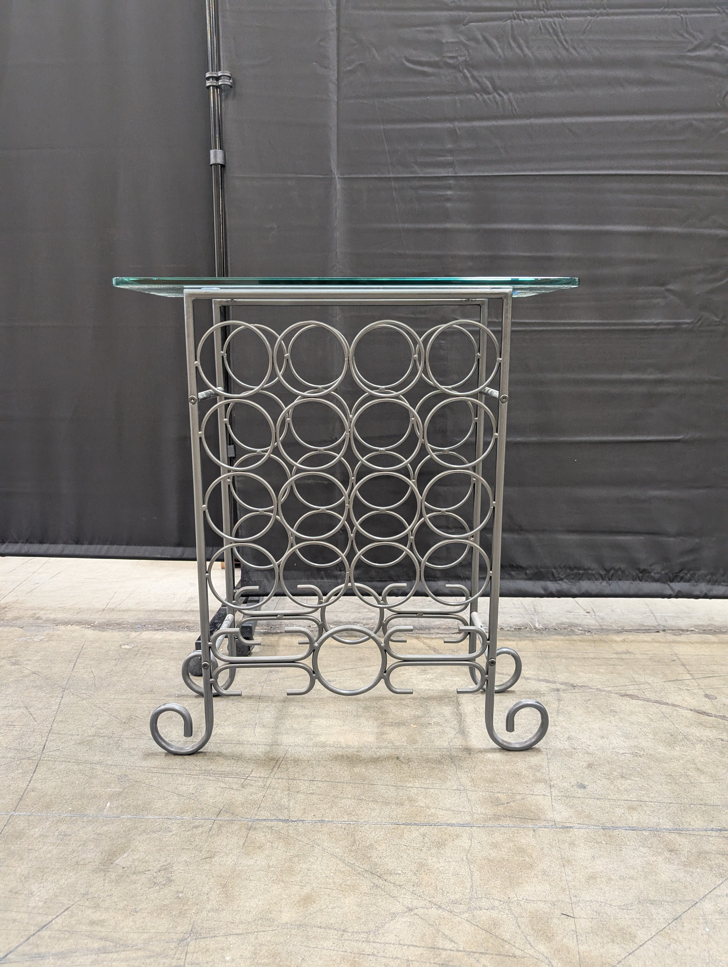 Industrial Style Metal Wine Rack with Glass Top and Wheels