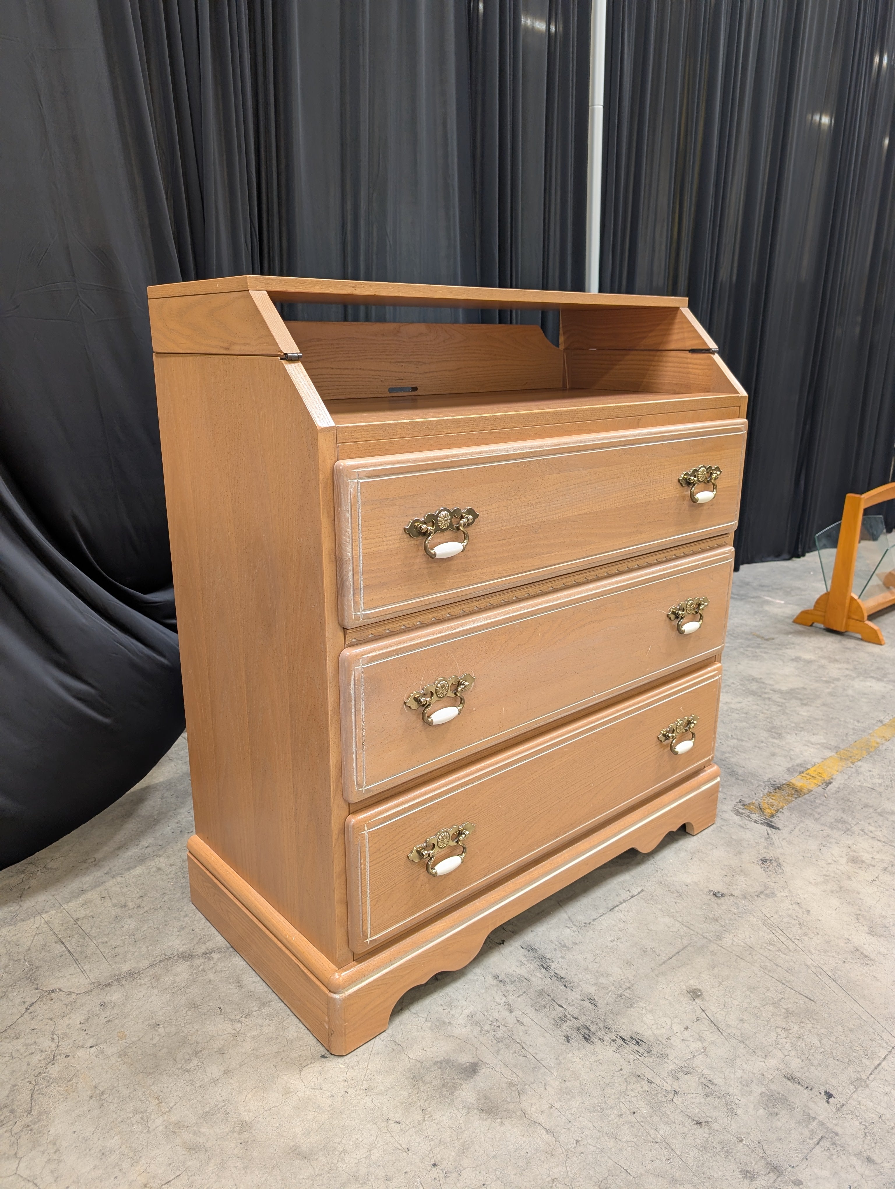 Light Brown Wood Dresser with Ornate Hardware